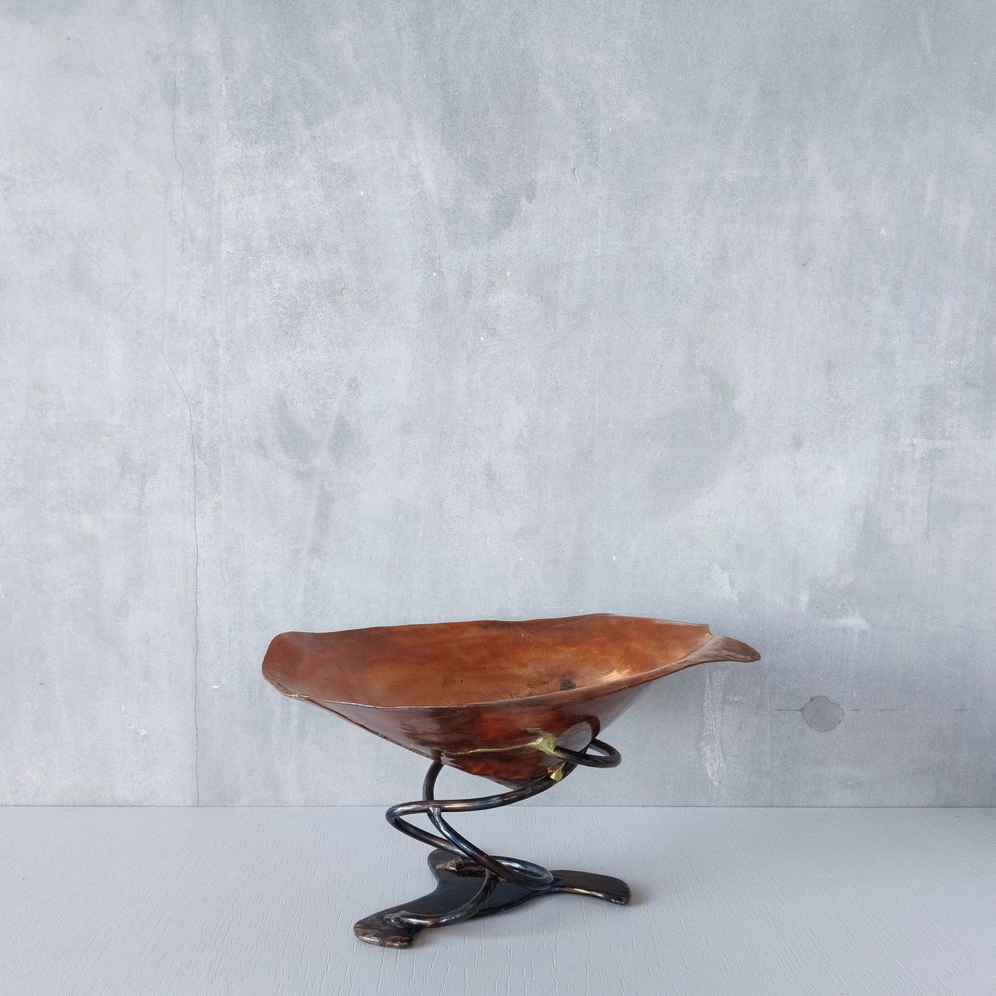 Artisan made copper metalwork conical footed bowl with twisted steel base signed