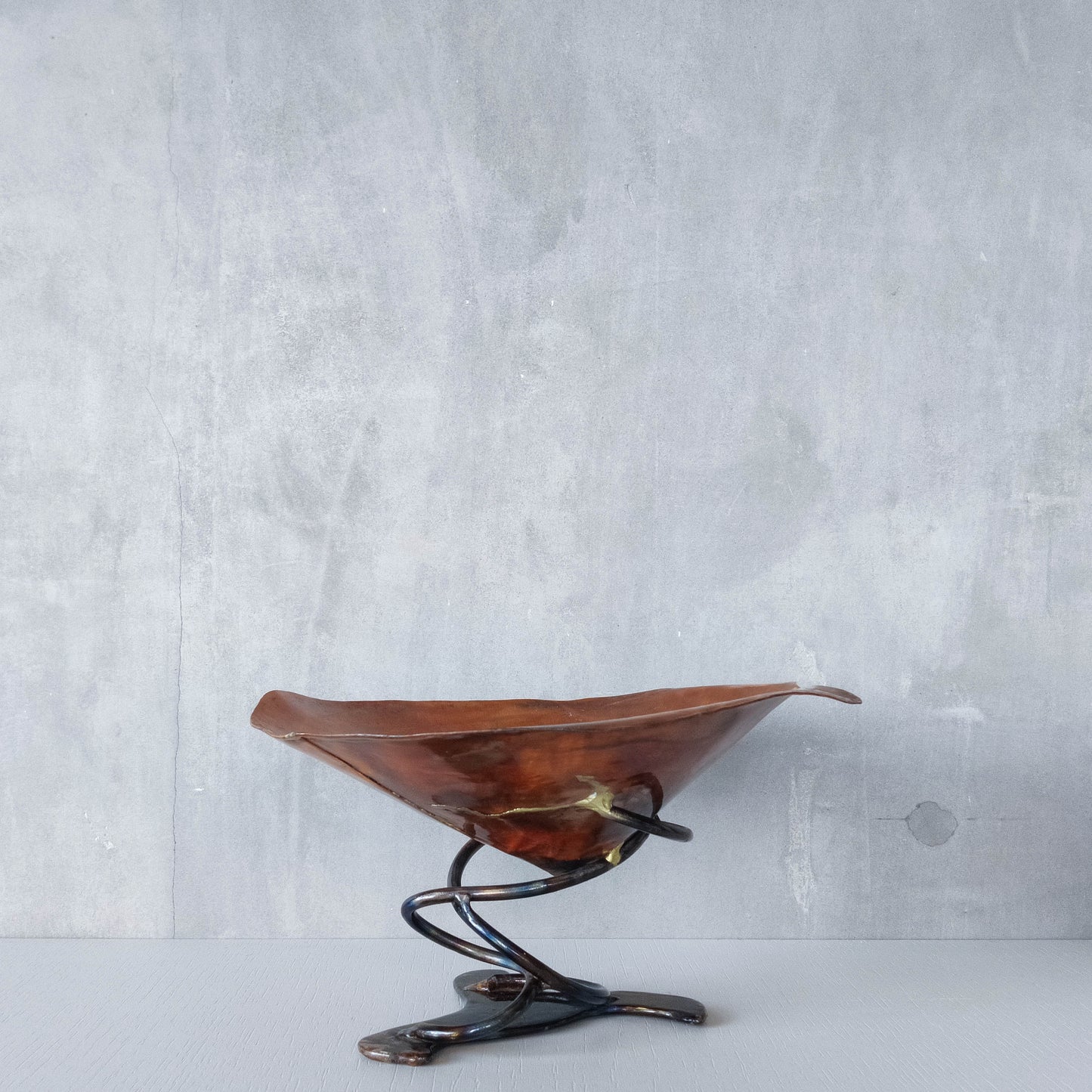 Artisan made copper metalwork conical footed bowl with twisted steel base signed