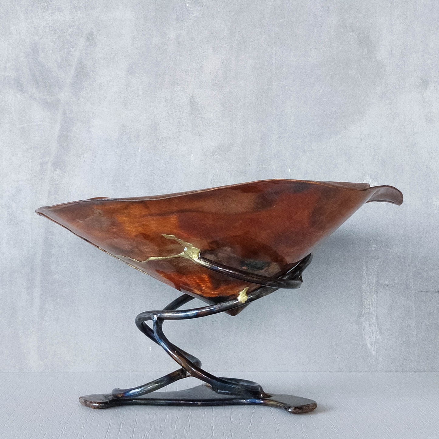 Artisan made copper metalwork conical footed bowl with twisted steel base signed