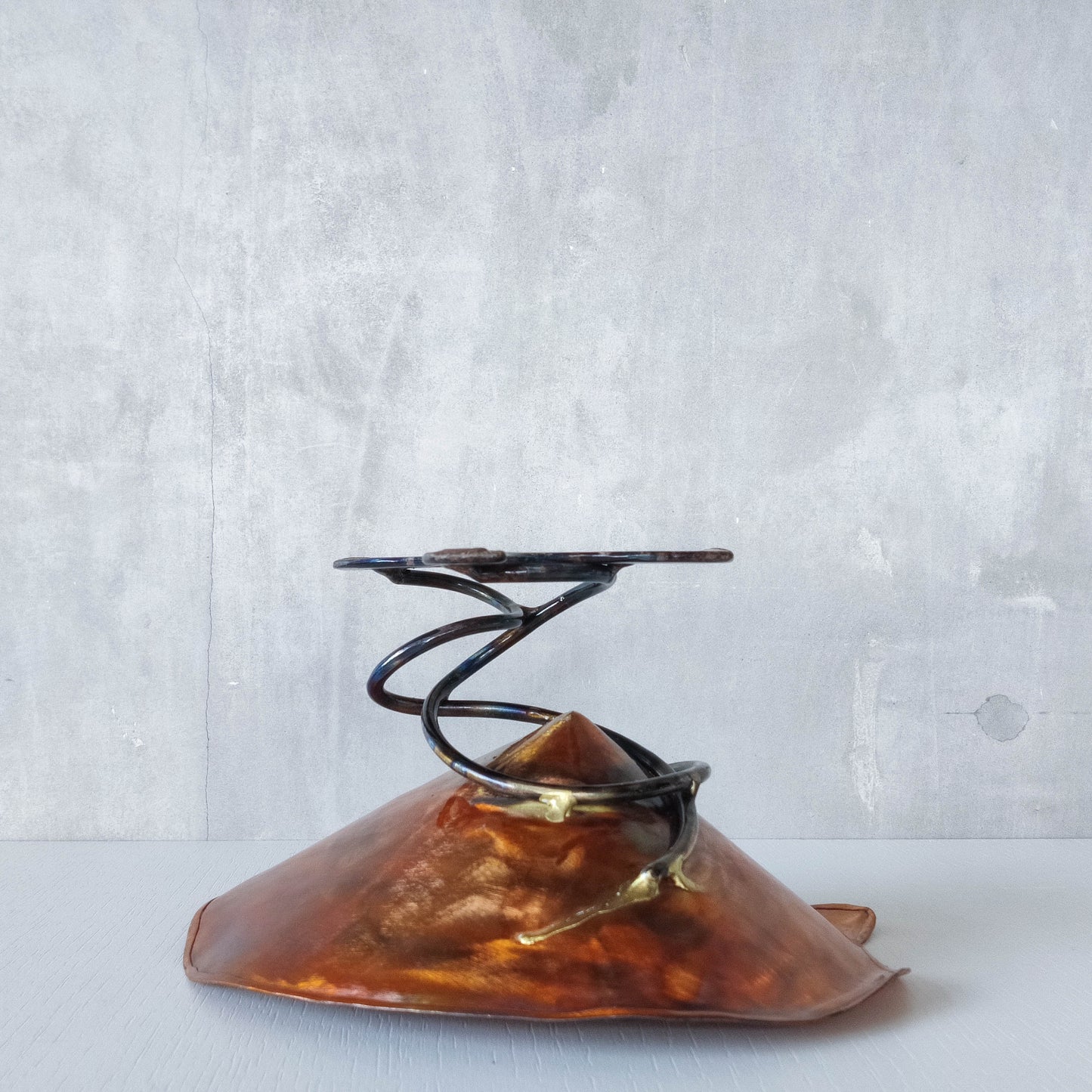Artisan made copper metalwork conical footed bowl with twisted steel base signed