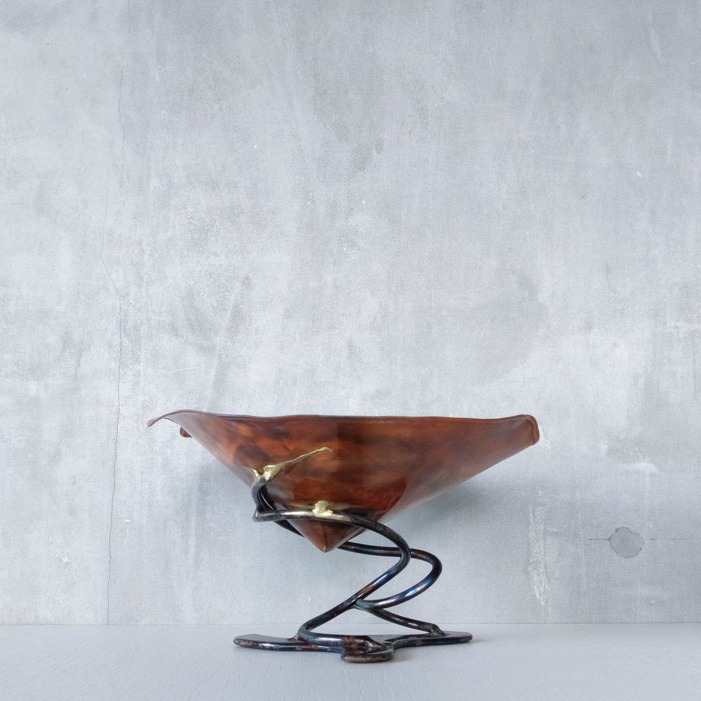 Artisan made copper metalwork conical footed bowl with twisted steel base signed