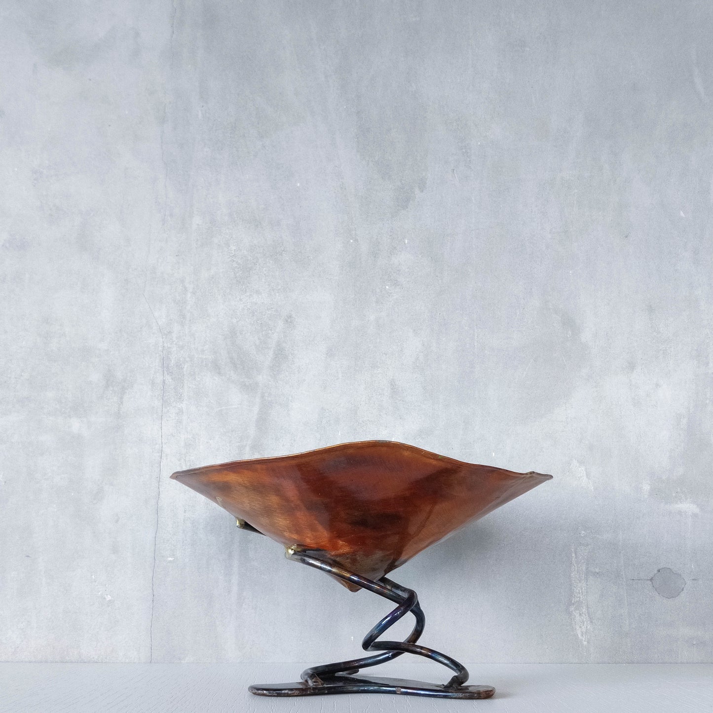 Artisan made copper metalwork conical footed bowl with twisted steel base signed