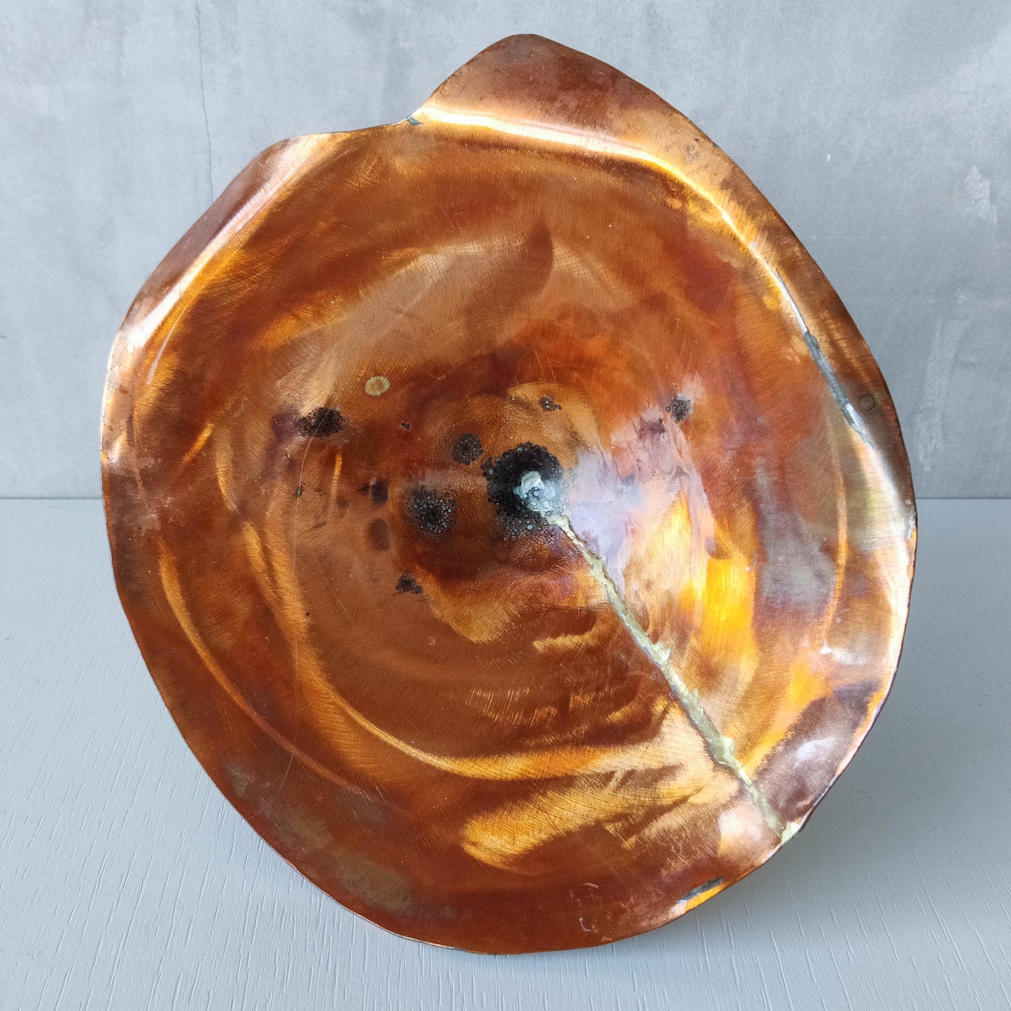 Artisan made copper metalwork conical footed bowl with twisted steel base signed