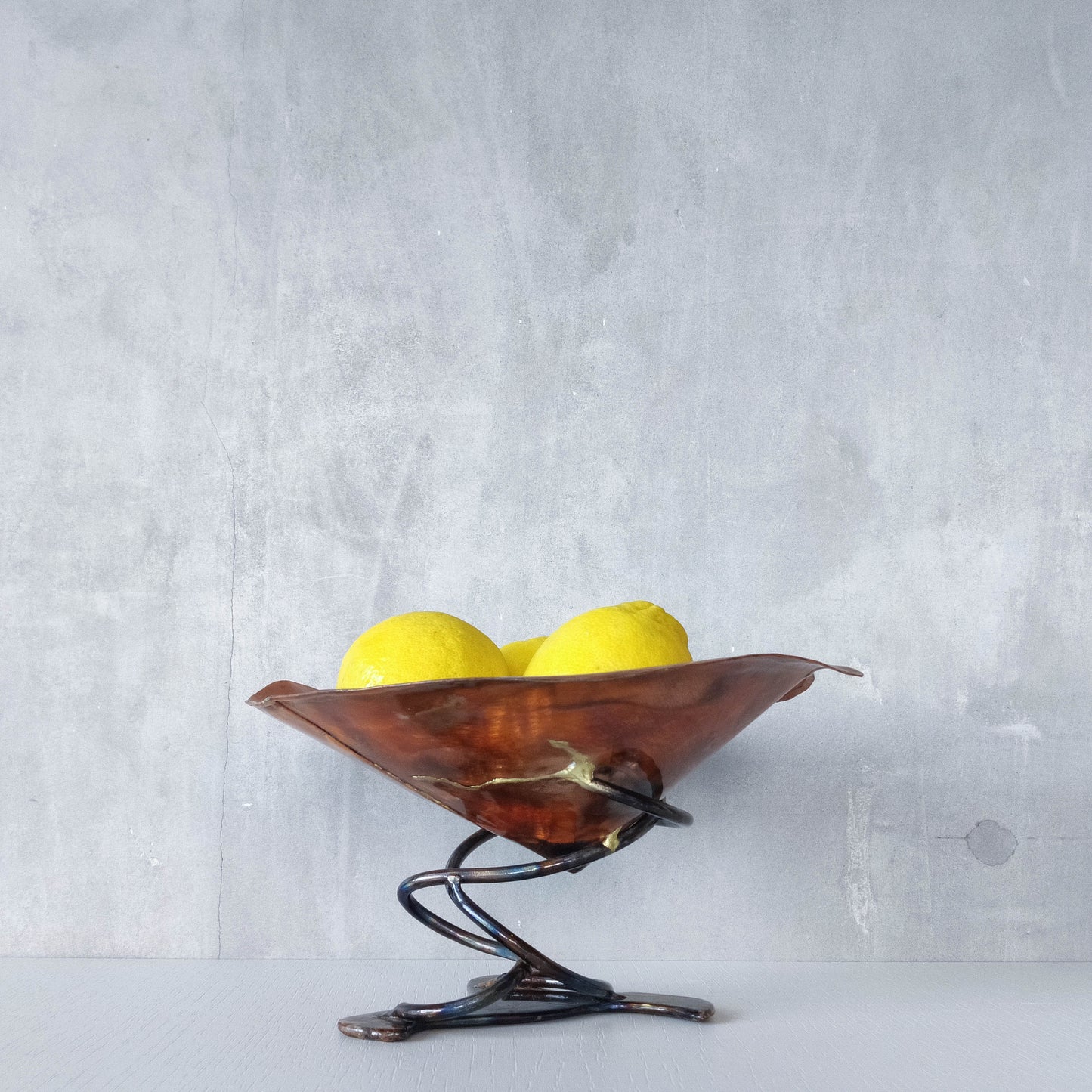 Artisan made copper metalwork conical footed bowl with twisted steel base signed