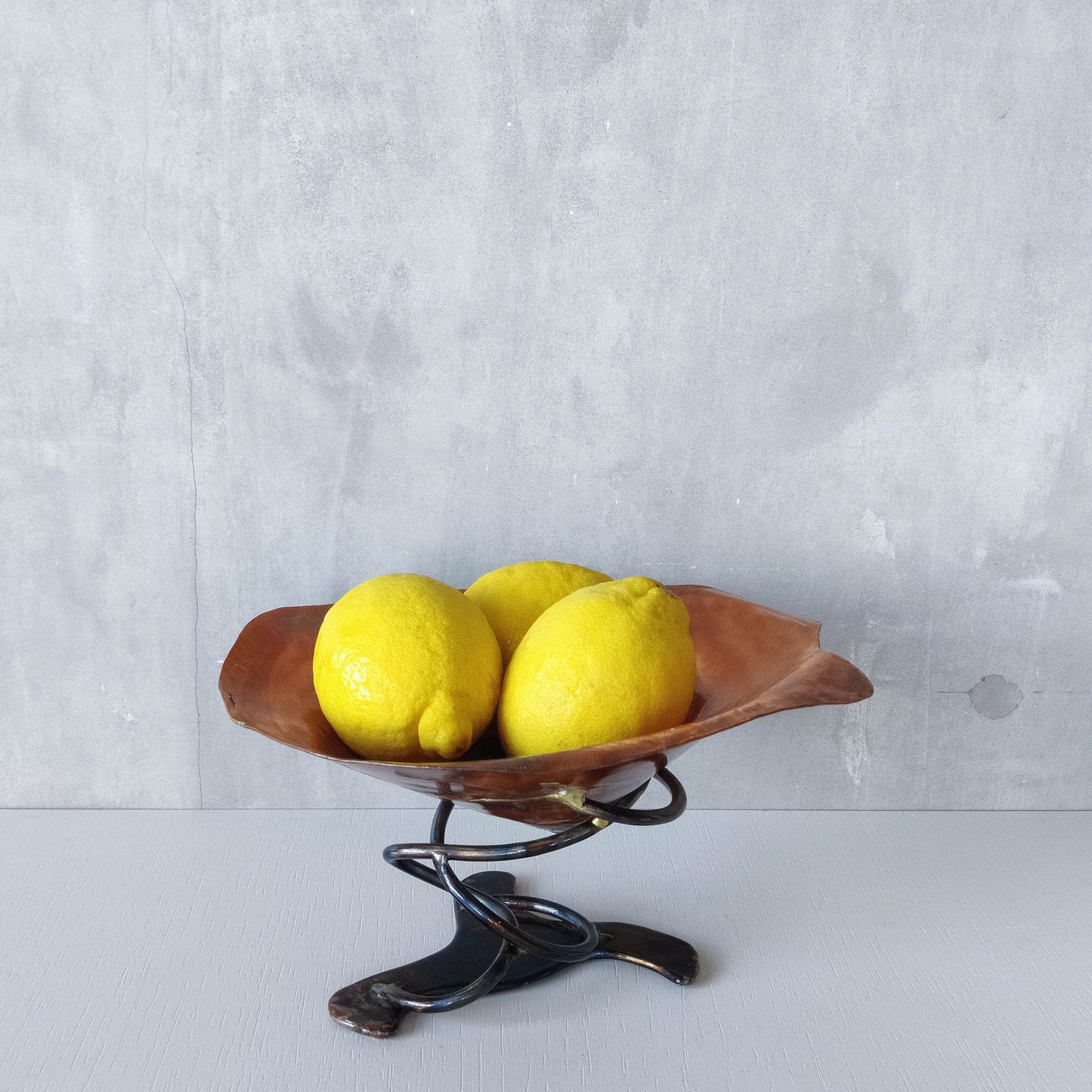 Artisan made copper metalwork conical footed bowl with twisted steel base signed