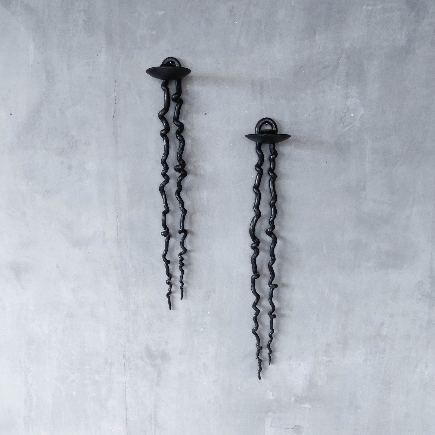 Pair of wrought iron blacksmith made twisted sculptural candle wall sconces