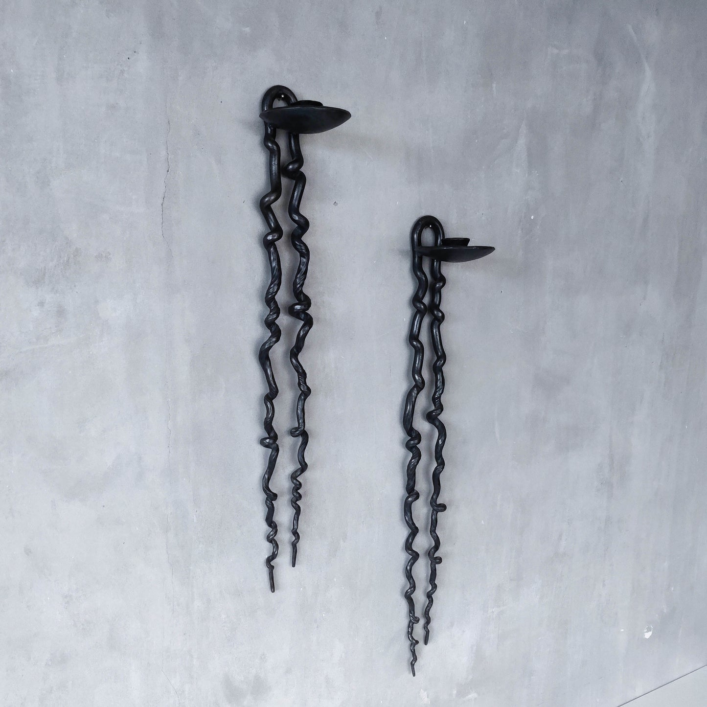 Pair of wrought iron blacksmith made twisted sculptural candle wall sconces
