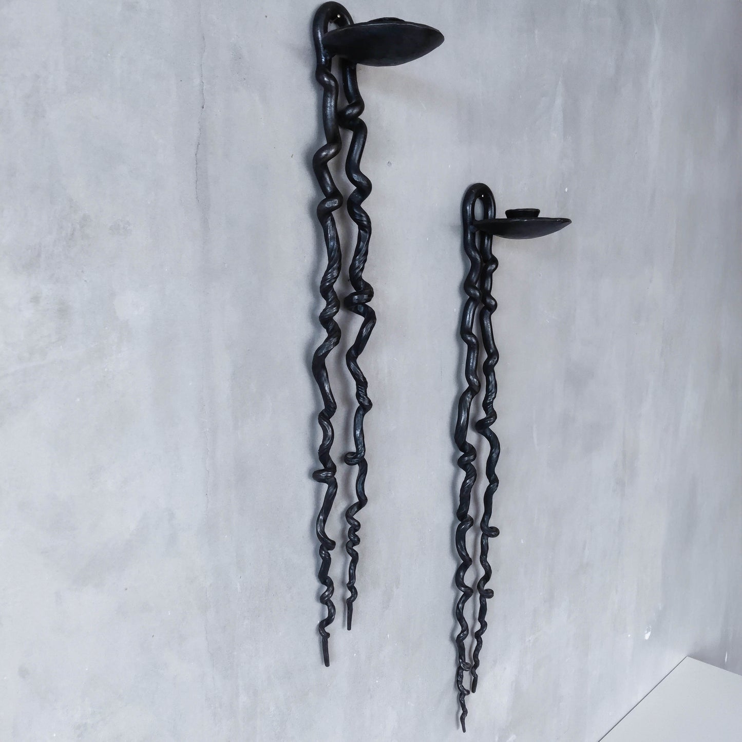 Pair of wrought iron blacksmith made twisted sculptural candle wall sconces