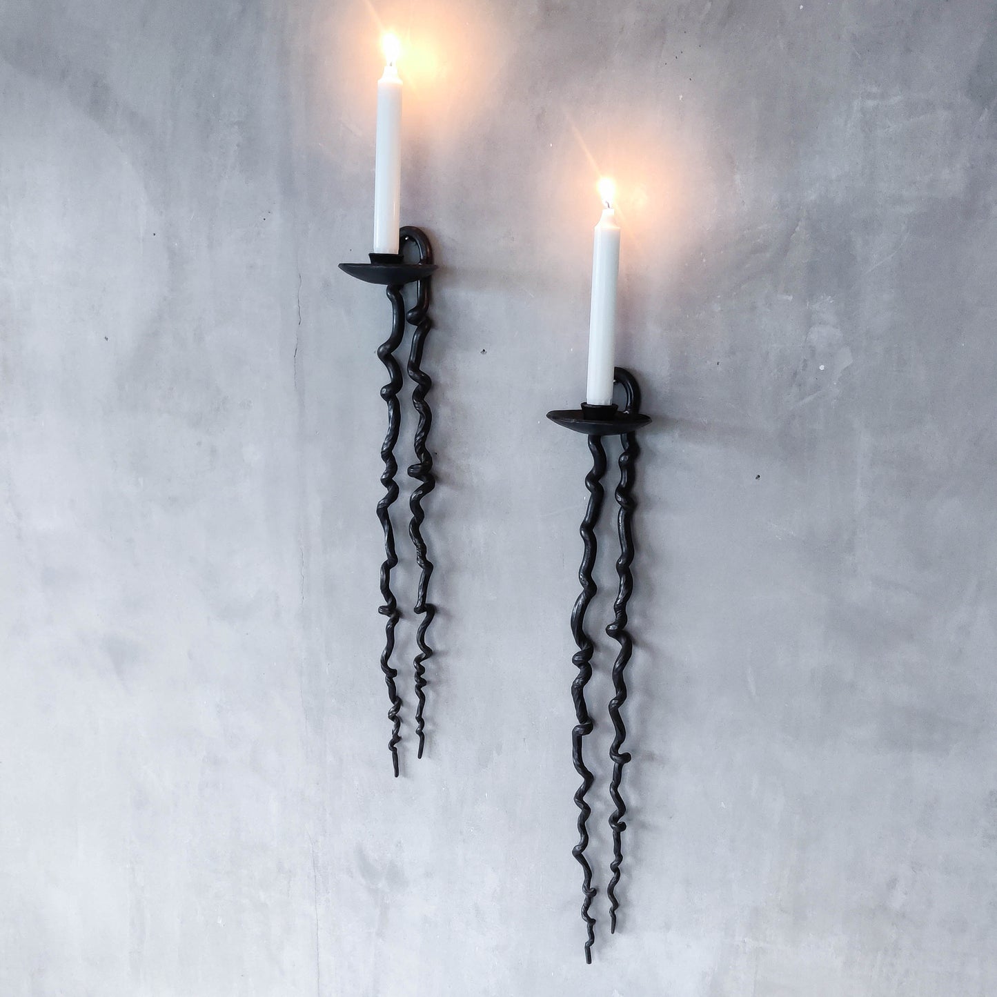 Pair of wrought iron blacksmith made twisted sculptural candle wall sconces