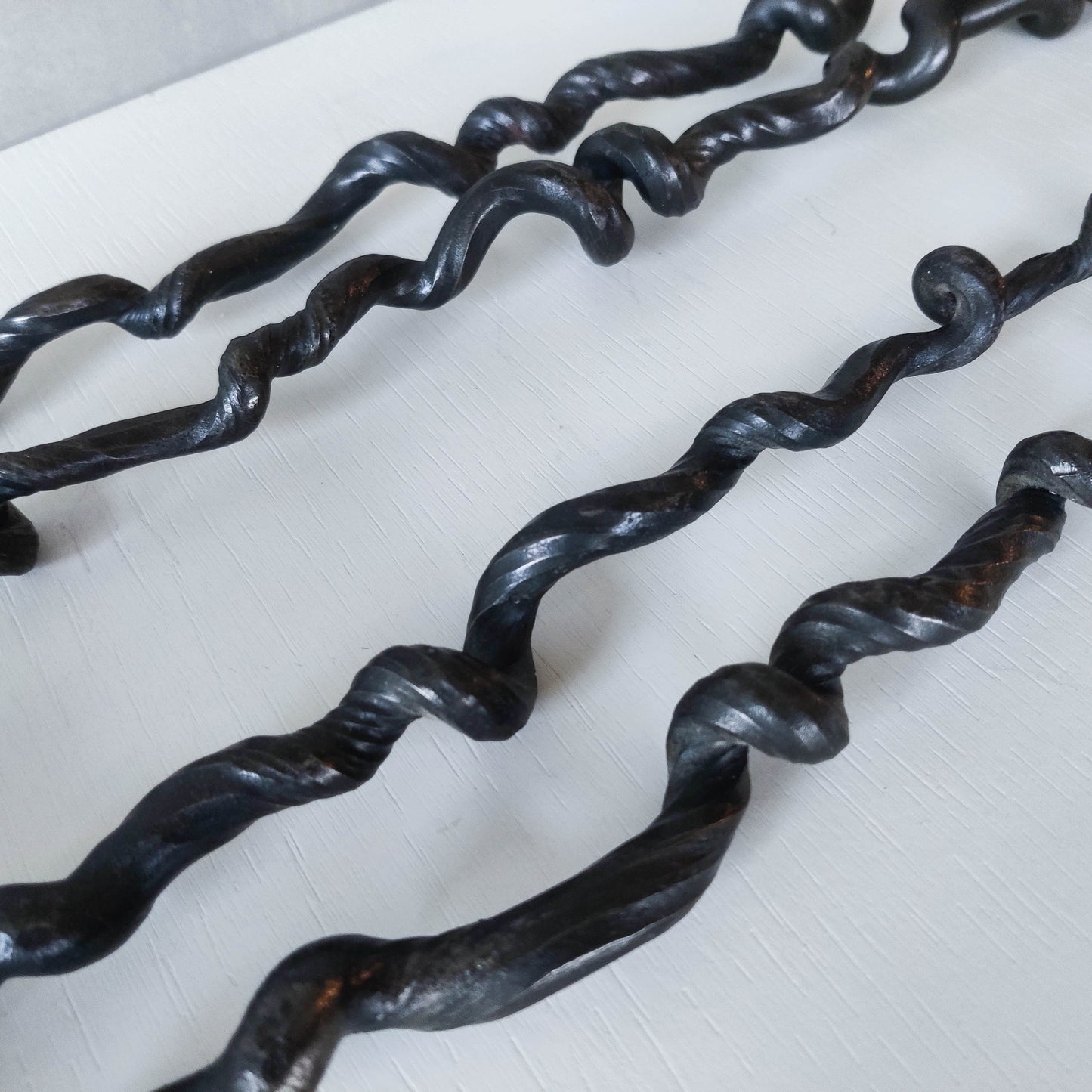 Pair of wrought iron blacksmith made twisted sculptural candle wall sconces