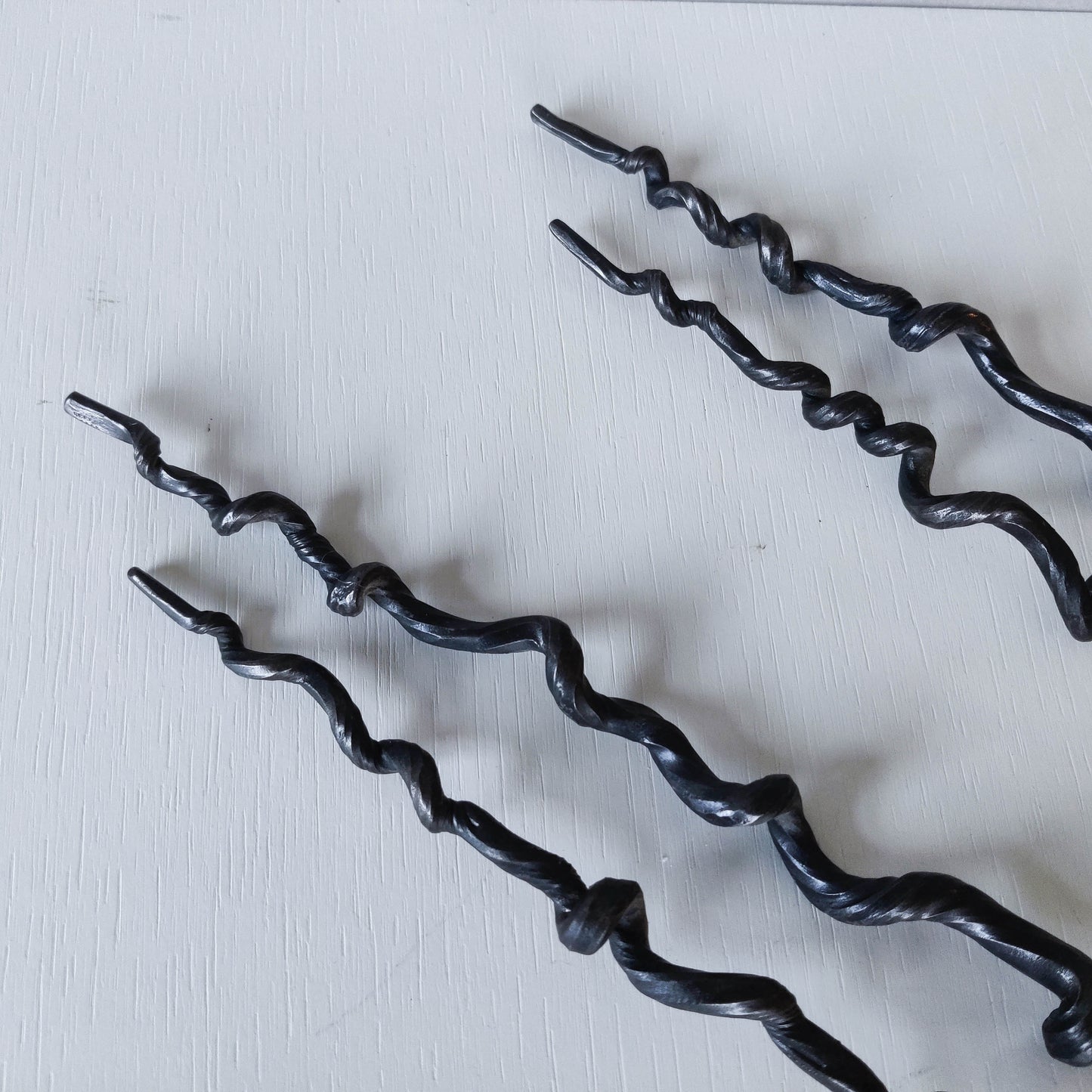 Pair of wrought iron blacksmith made twisted sculptural candle wall sconces