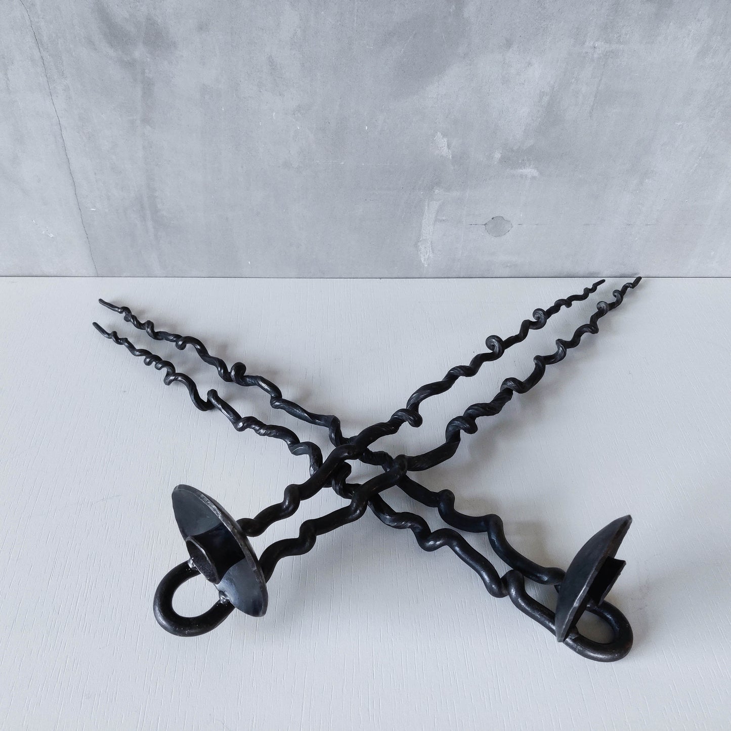 Pair of wrought iron blacksmith made twisted sculptural candle wall sconces