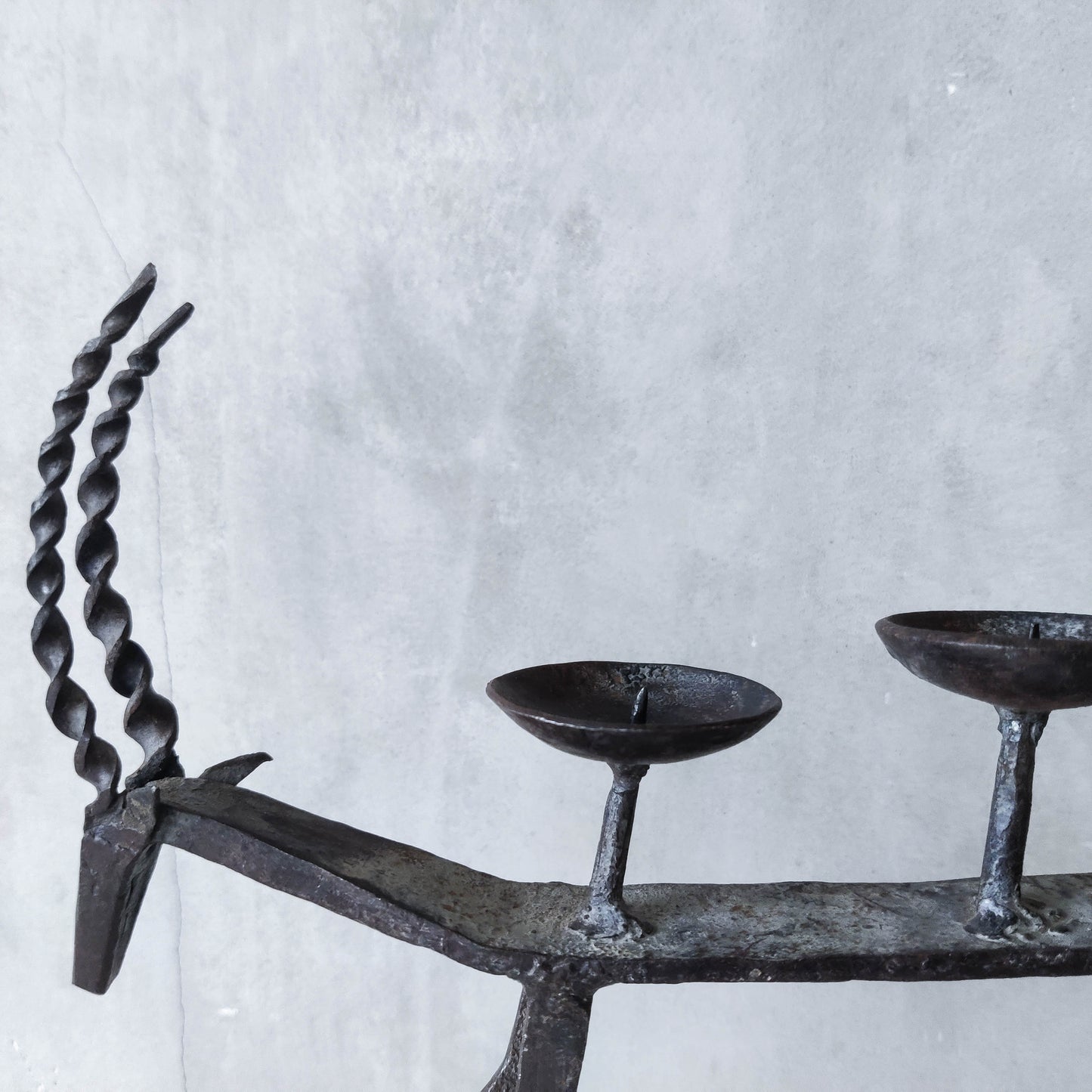 Pair of brutalist vintage wrought iron primitive antelope deer candelabras