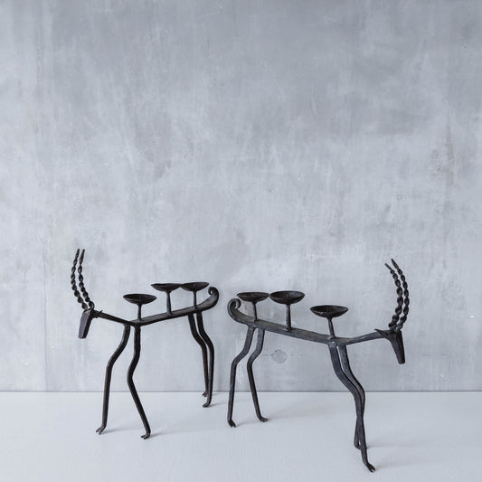 Pair of brutalist vintage wrought iron primitive antelope deer candelabras