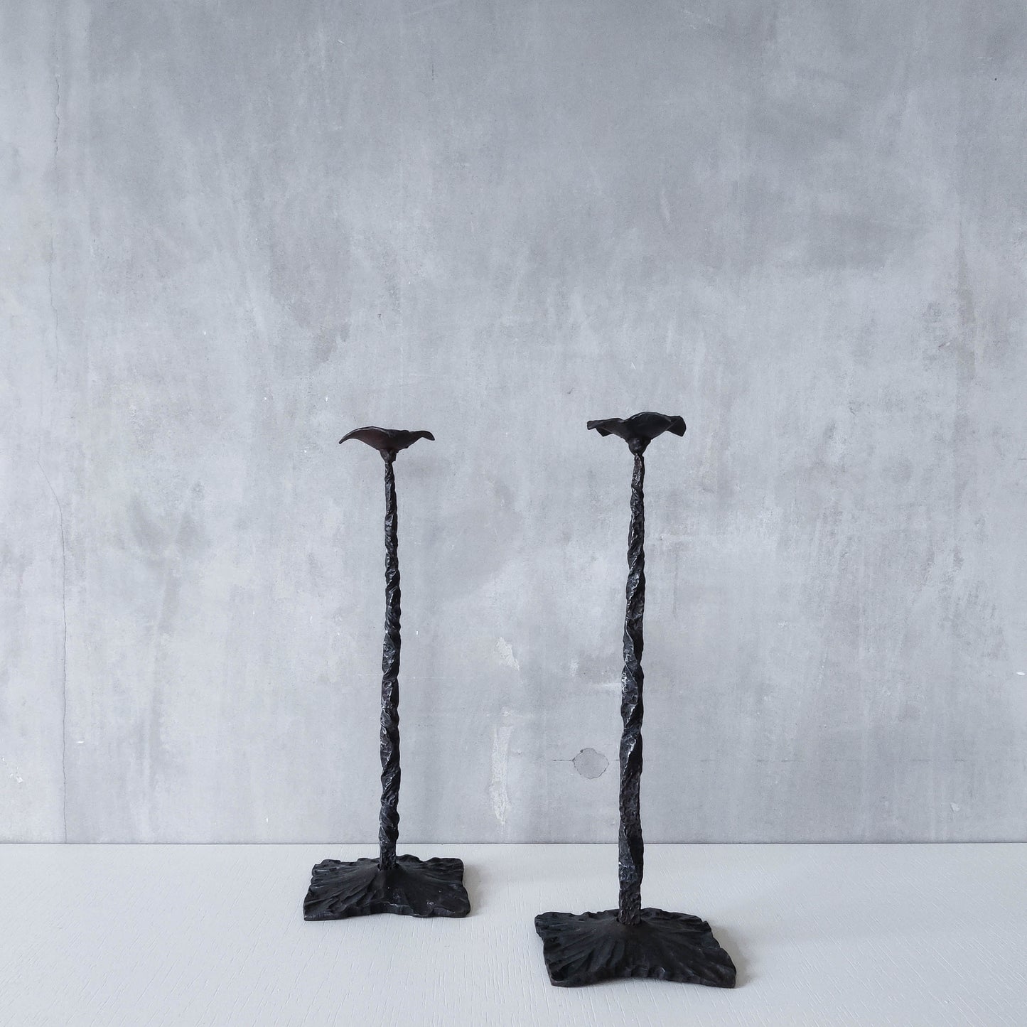 Pair of brutalist style hammered wrought iron blacksmith made pricket top candle holders