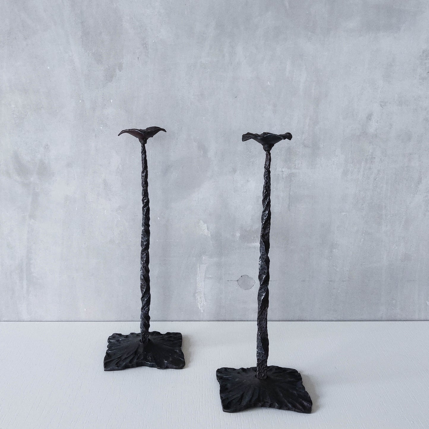 Pair of brutalist style hammered wrought iron blacksmith made pricket top candle holders
