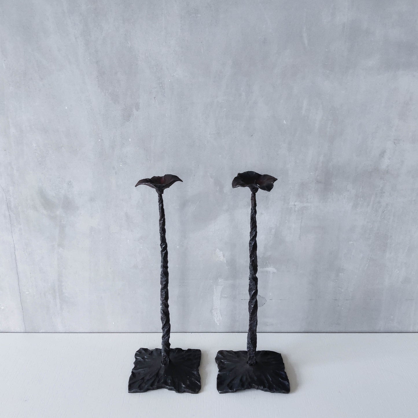 Pair of brutalist style hammered wrought iron blacksmith made pricket top candle holders