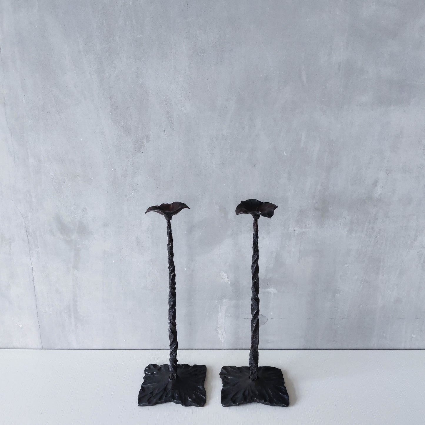 Pair of brutalist style hammered wrought iron blacksmith made pricket top candle holders