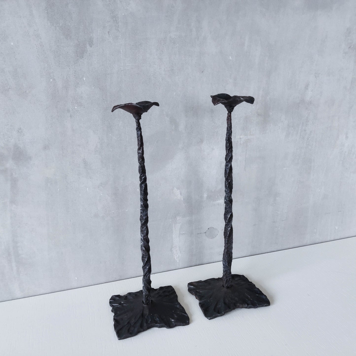 Pair of brutalist style hammered wrought iron blacksmith made pricket top candle holders