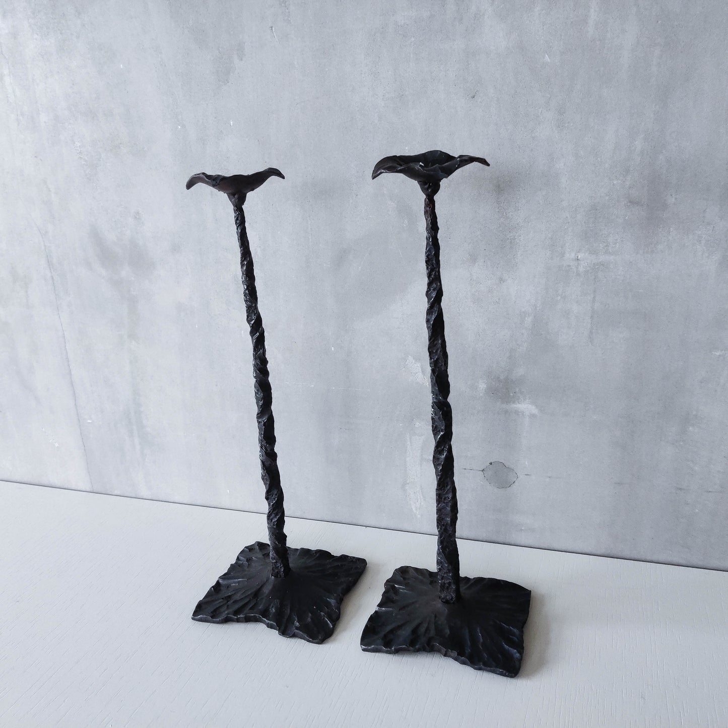 Pair of brutalist style hammered wrought iron blacksmith made pricket top candle holders