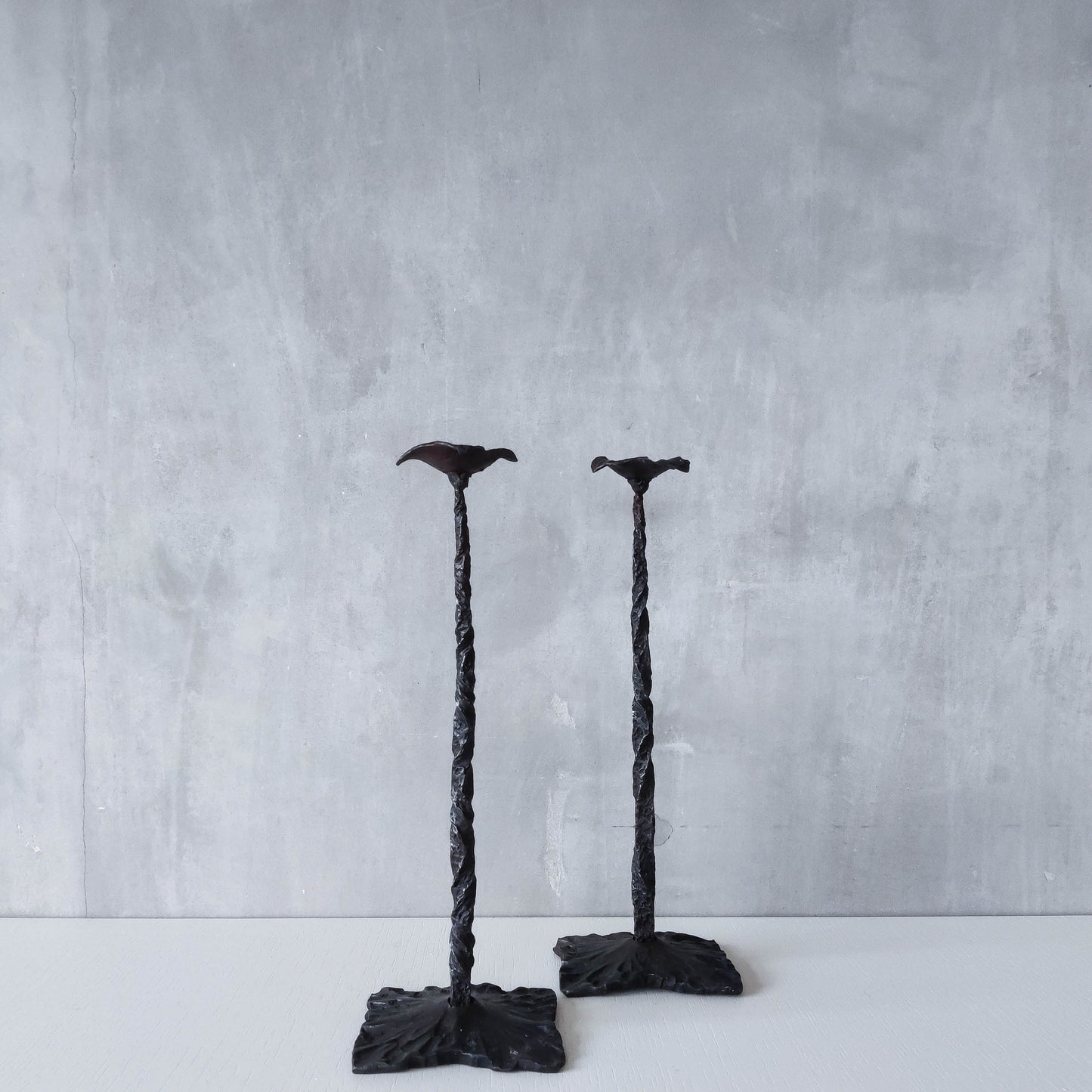 Pair of brutalist style hammered wrought iron blacksmith made pricket top candle holders