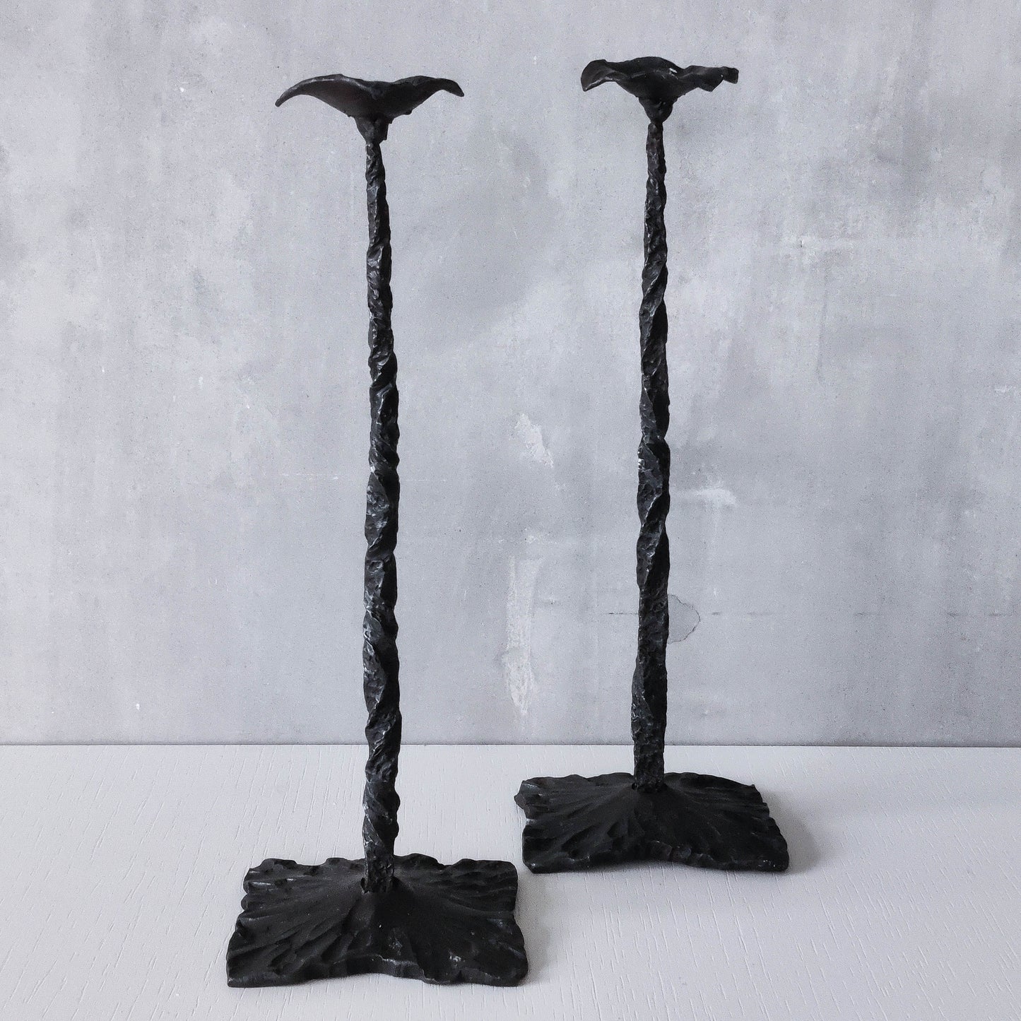 Pair of brutalist style hammered wrought iron blacksmith made pricket top candle holders