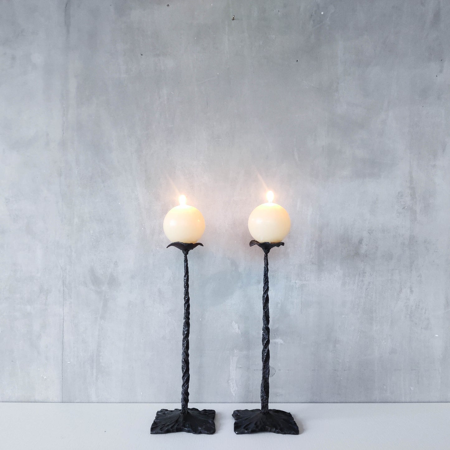 Pair of brutalist style hammered wrought iron blacksmith made pricket top candle holders