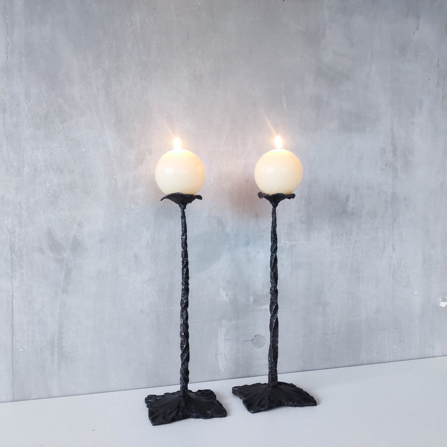 Pair of brutalist style hammered wrought iron blacksmith made pricket top candle holders