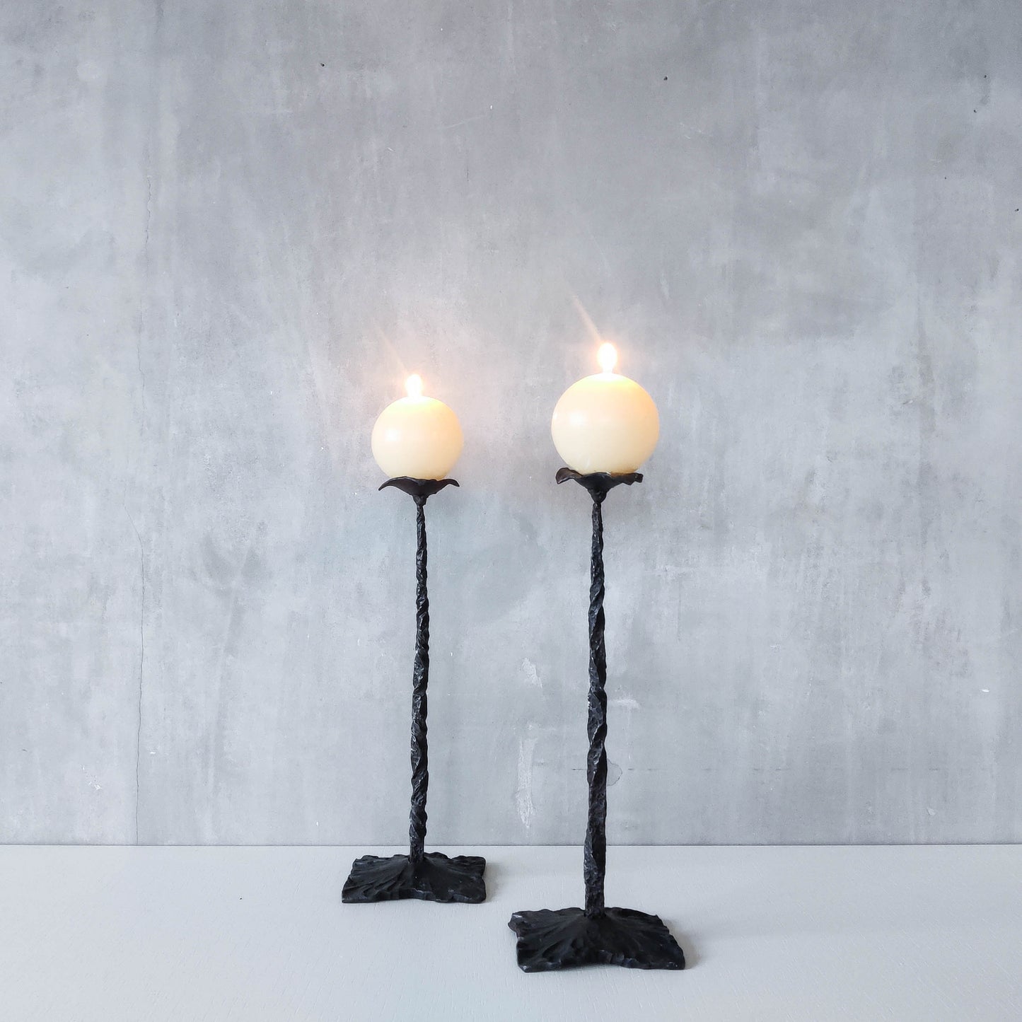 Pair of brutalist style hammered wrought iron blacksmith made pricket top candle holders