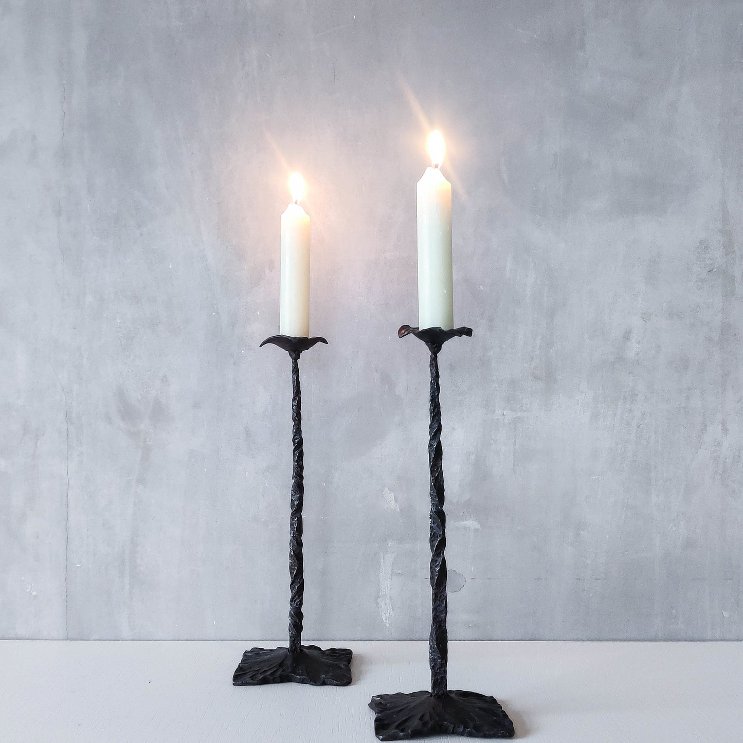 Pair of brutalist style hammered wrought iron blacksmith made pricket top candle holders