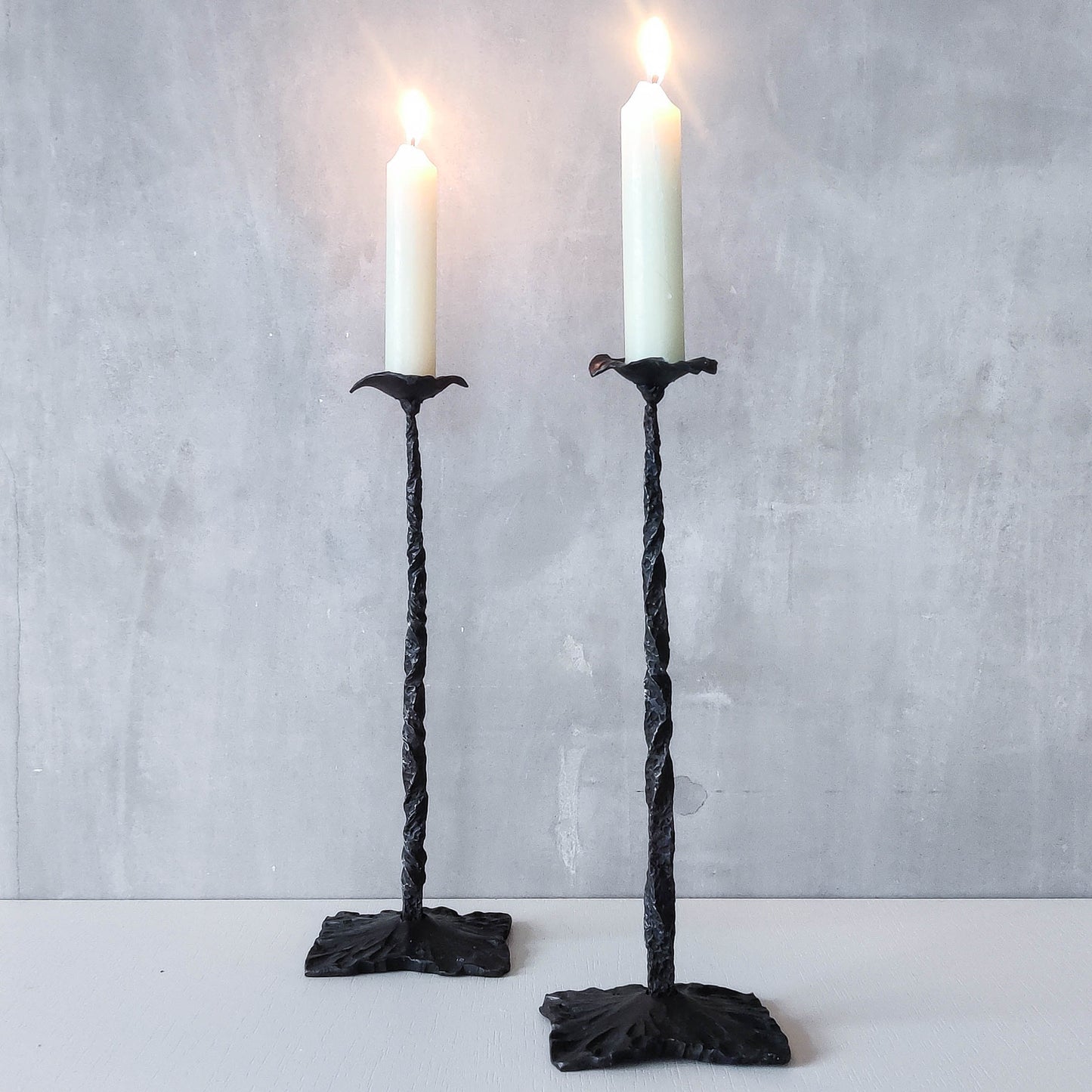 Pair of brutalist style hammered wrought iron blacksmith made pricket top candle holders