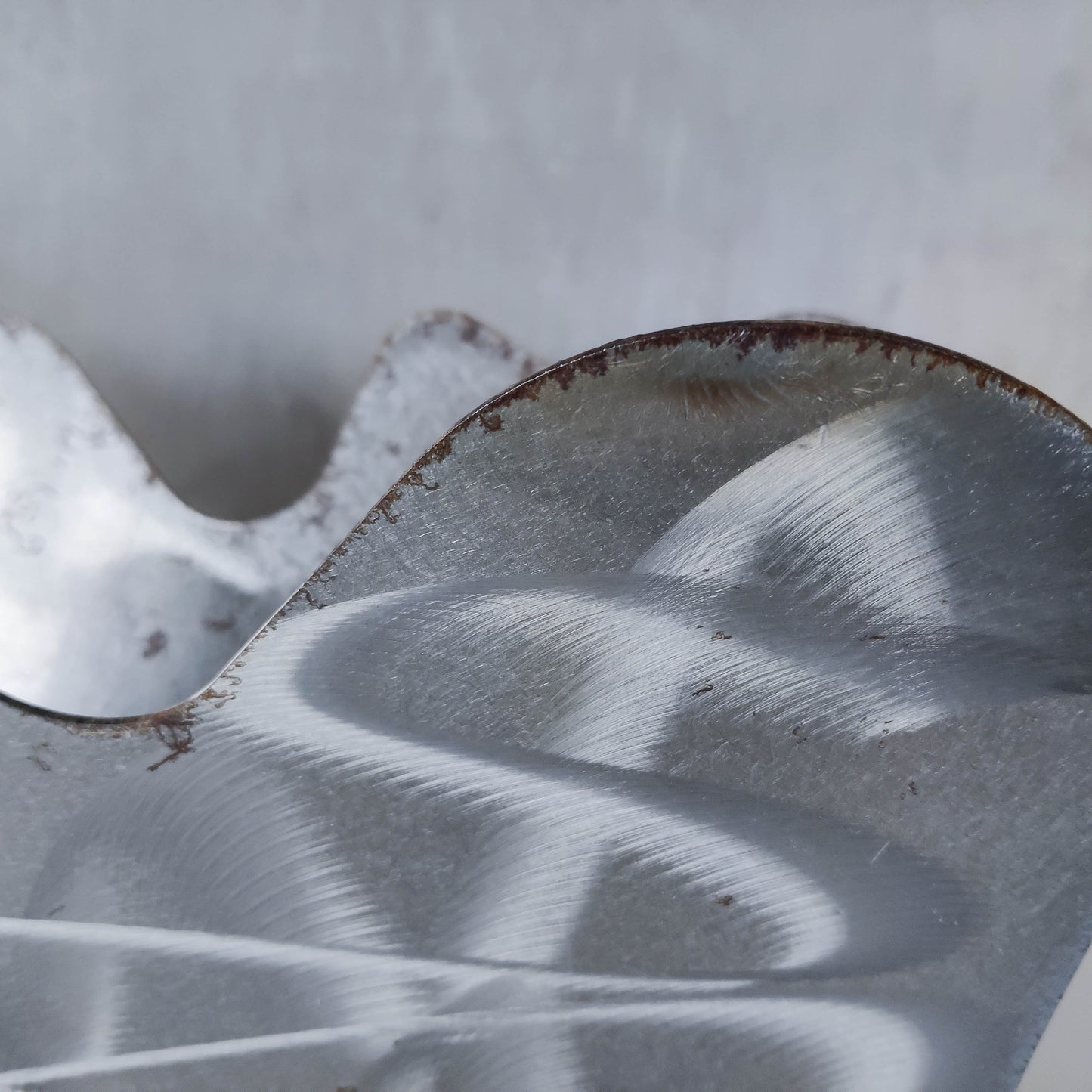 Vintage 1990s postmodern welded steel sculptural magazine rack with spiral ball feet