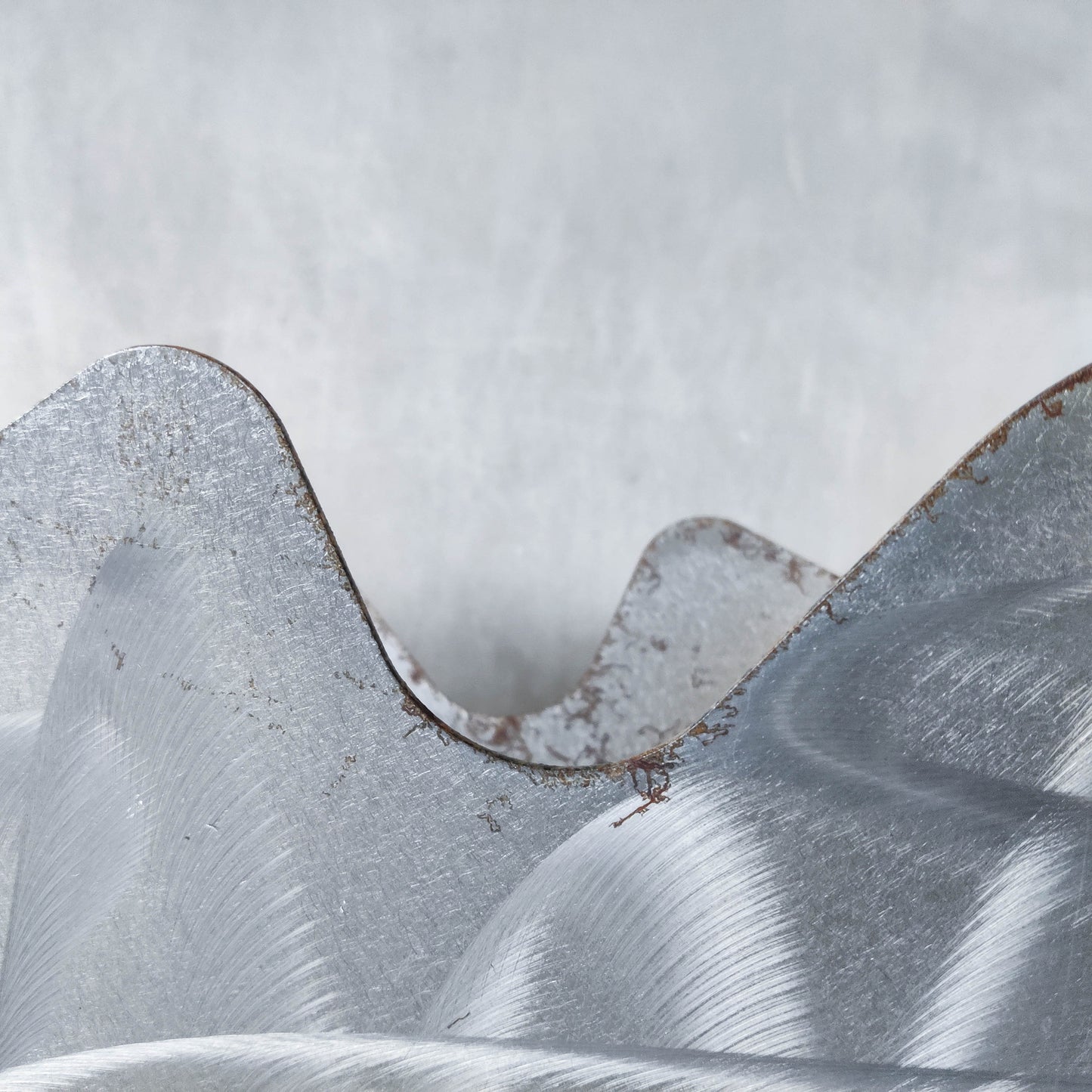 Vintage 1990s postmodern welded steel sculptural magazine rack with spiral ball feet