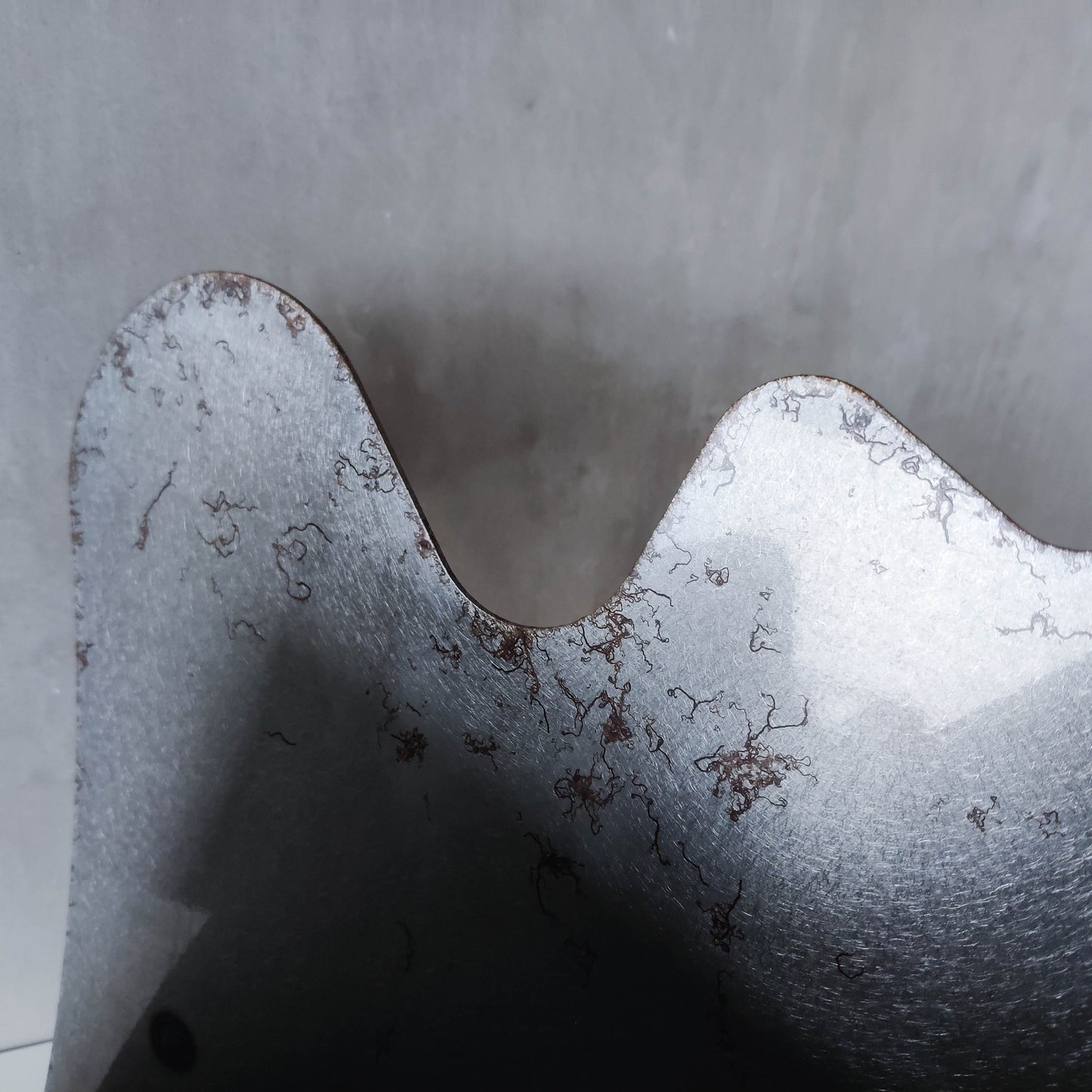 Vintage 1990s postmodern welded steel sculptural magazine rack with spiral ball feet