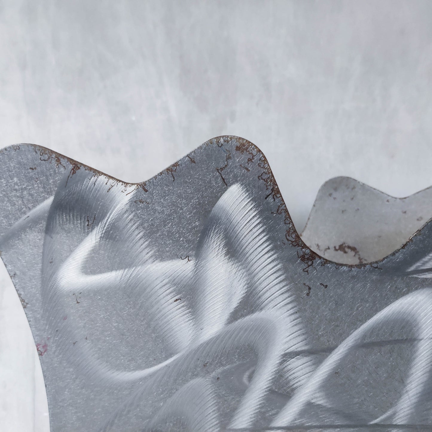 Vintage 1990s postmodern welded steel sculptural magazine rack with spiral ball feet