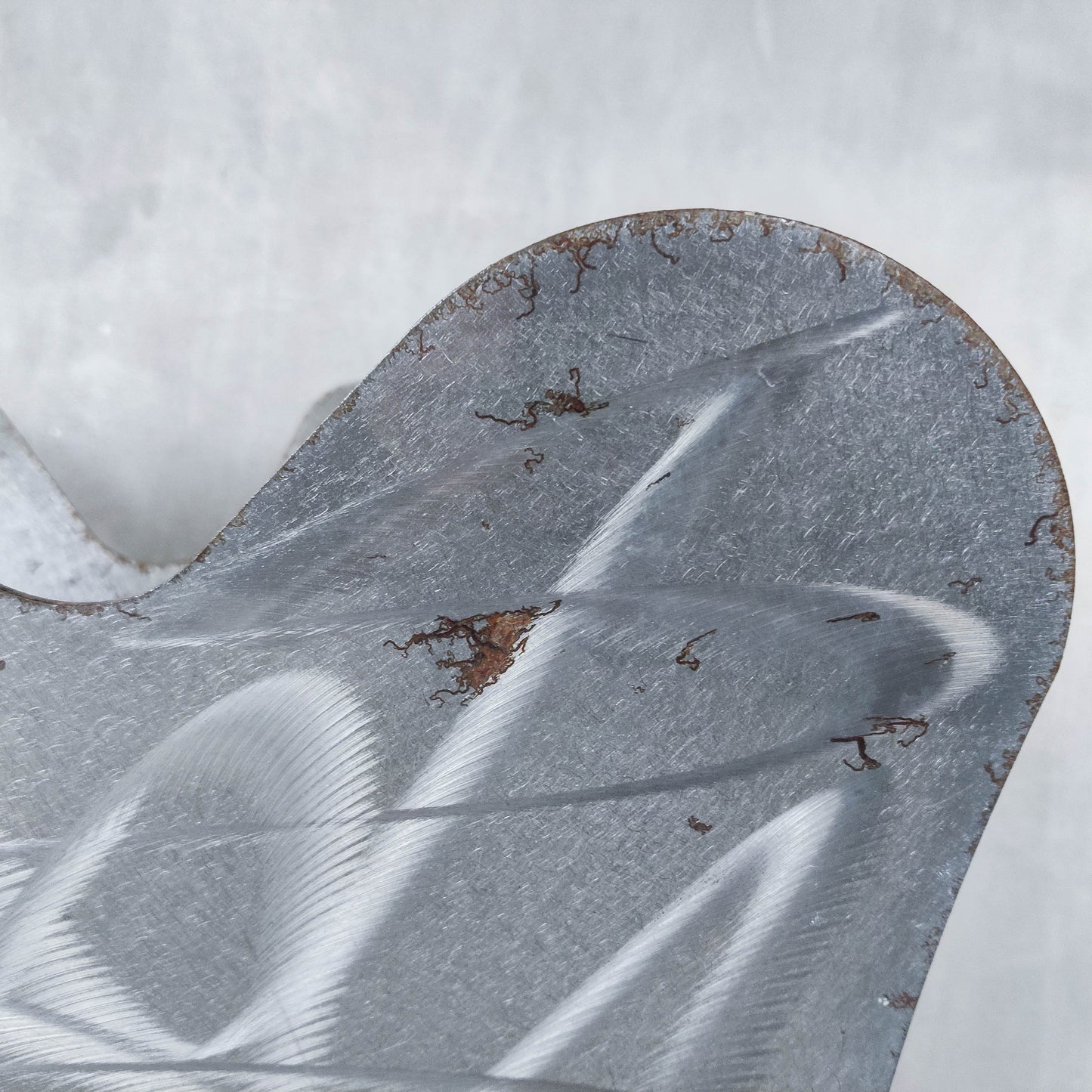 Vintage 1990s postmodern welded steel sculptural magazine rack with spiral ball feet