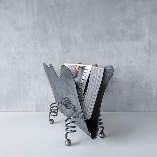 Vintage 1990s postmodern welded steel sculptural magazine rack with spiral ball feet