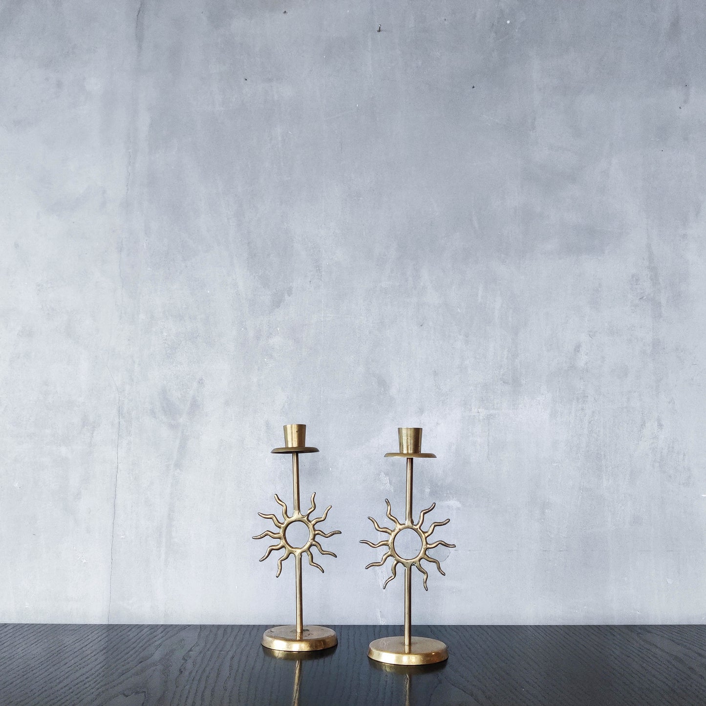 Vintage 1990s pair of cast brass Fornasetti style sun celestial candle holders