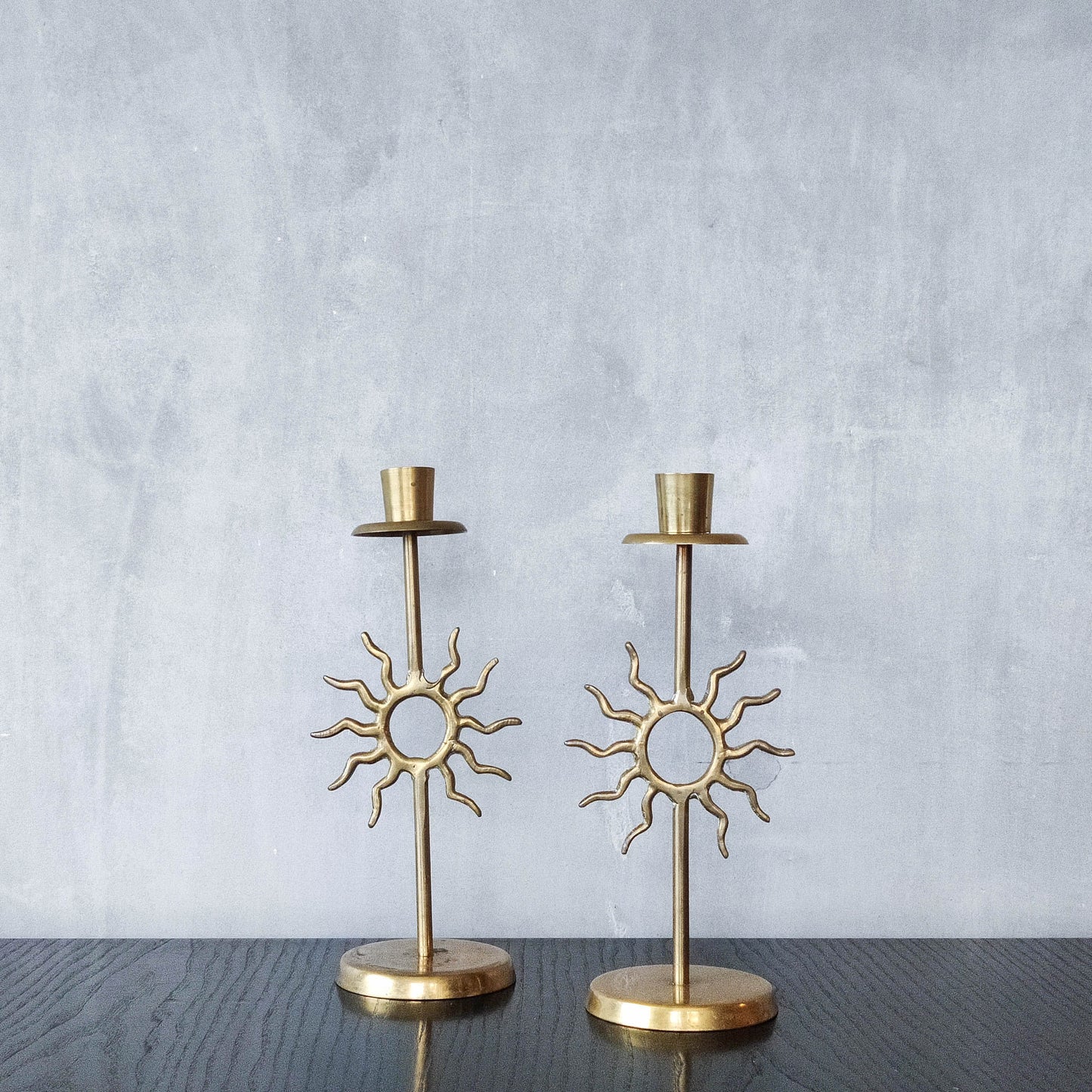 Vintage 1990s pair of cast brass Fornasetti style sun celestial candle holders