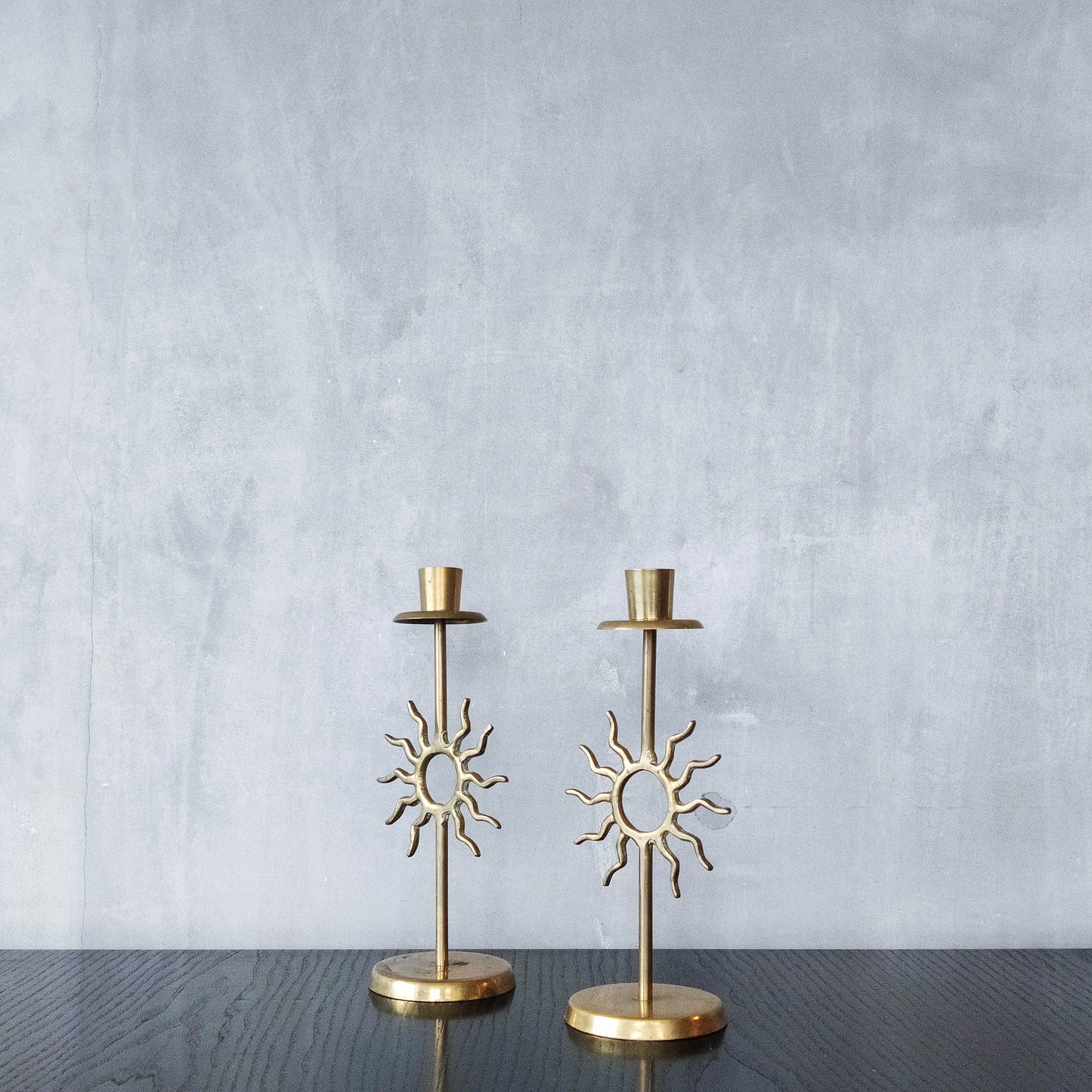 Vintage 1990s pair of cast brass Fornasetti style sun celestial candle holders