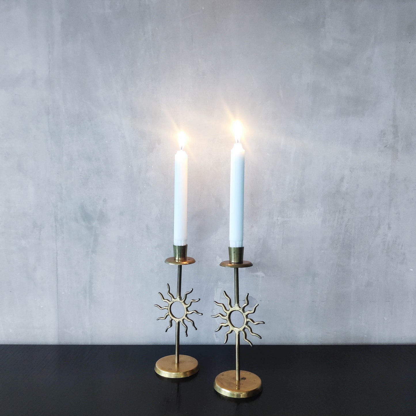 Vintage 1990s pair of cast brass Fornasetti style sun celestial candle holders