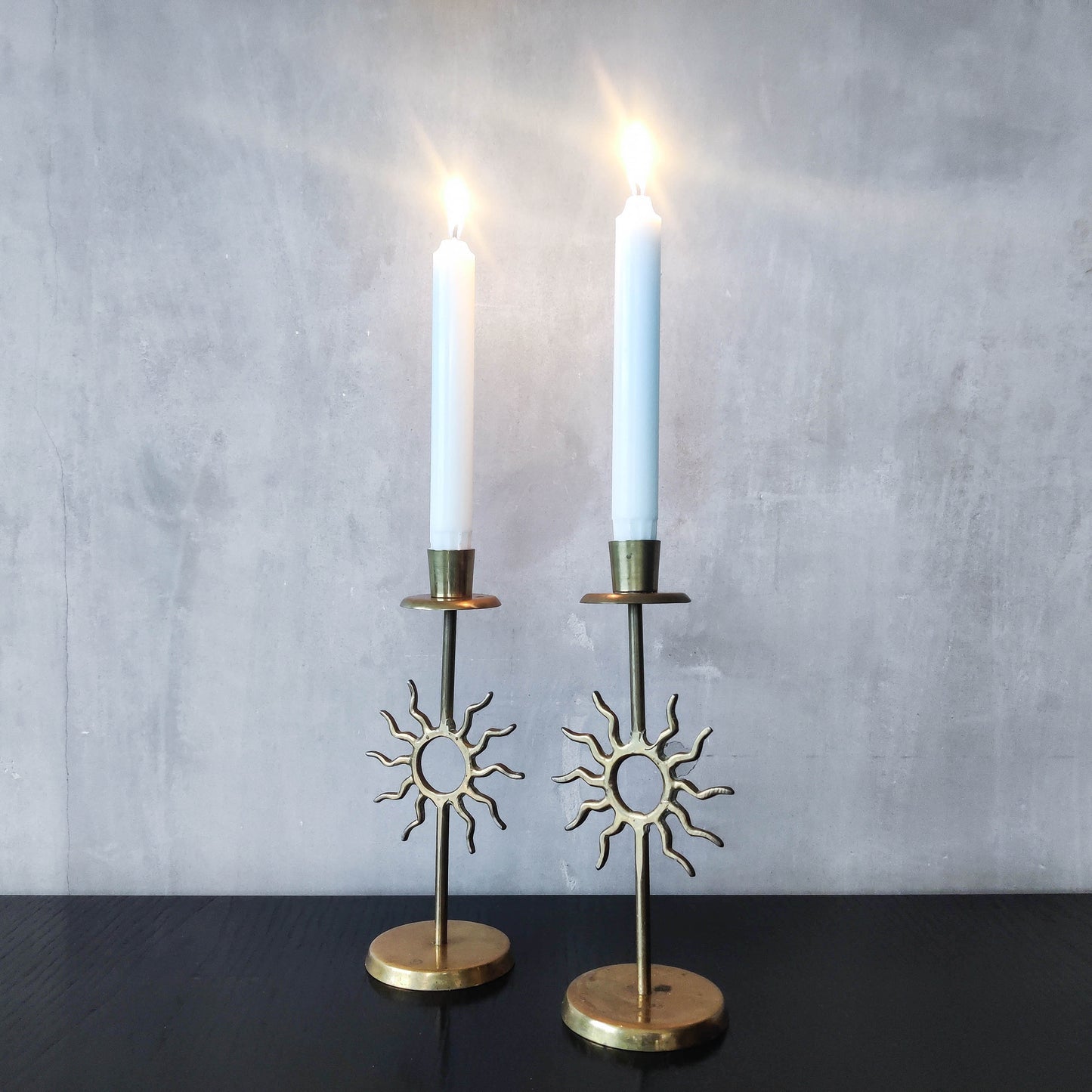 Vintage 1990s pair of cast brass Fornasetti style sun celestial candle holders