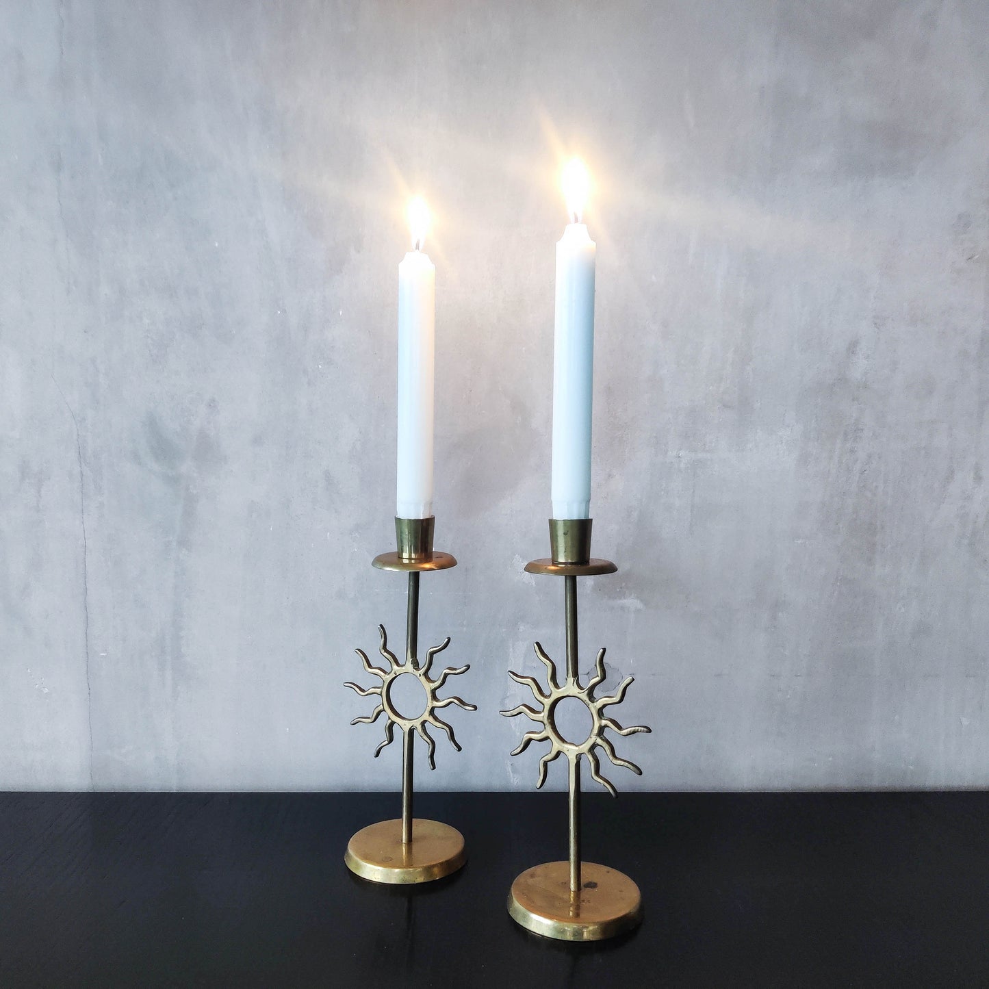 Vintage 1990s pair of cast brass Fornasetti style sun celestial candle holders