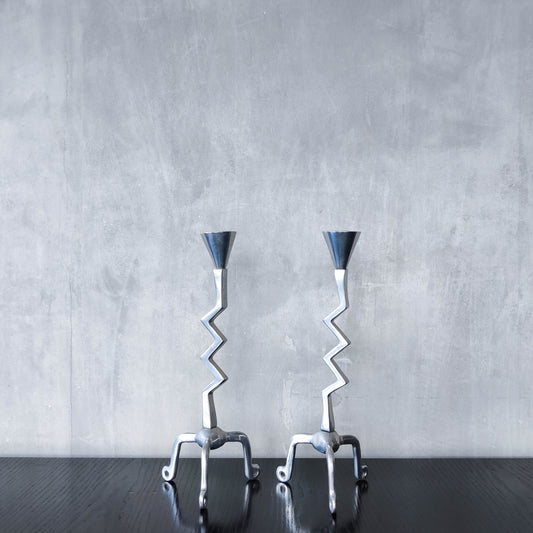 Pair of vintage postmodern chunky sculptural zigzag cast aluminium footed candle holders
