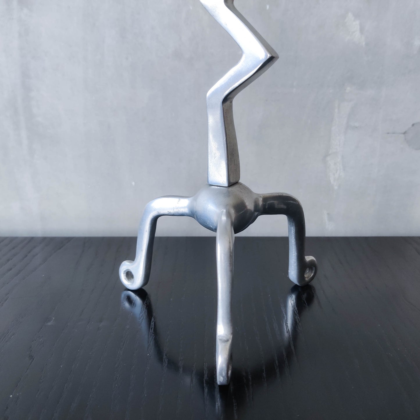 Pair of vintage postmodern chunky sculptural zigzag cast aluminium footed candle holders