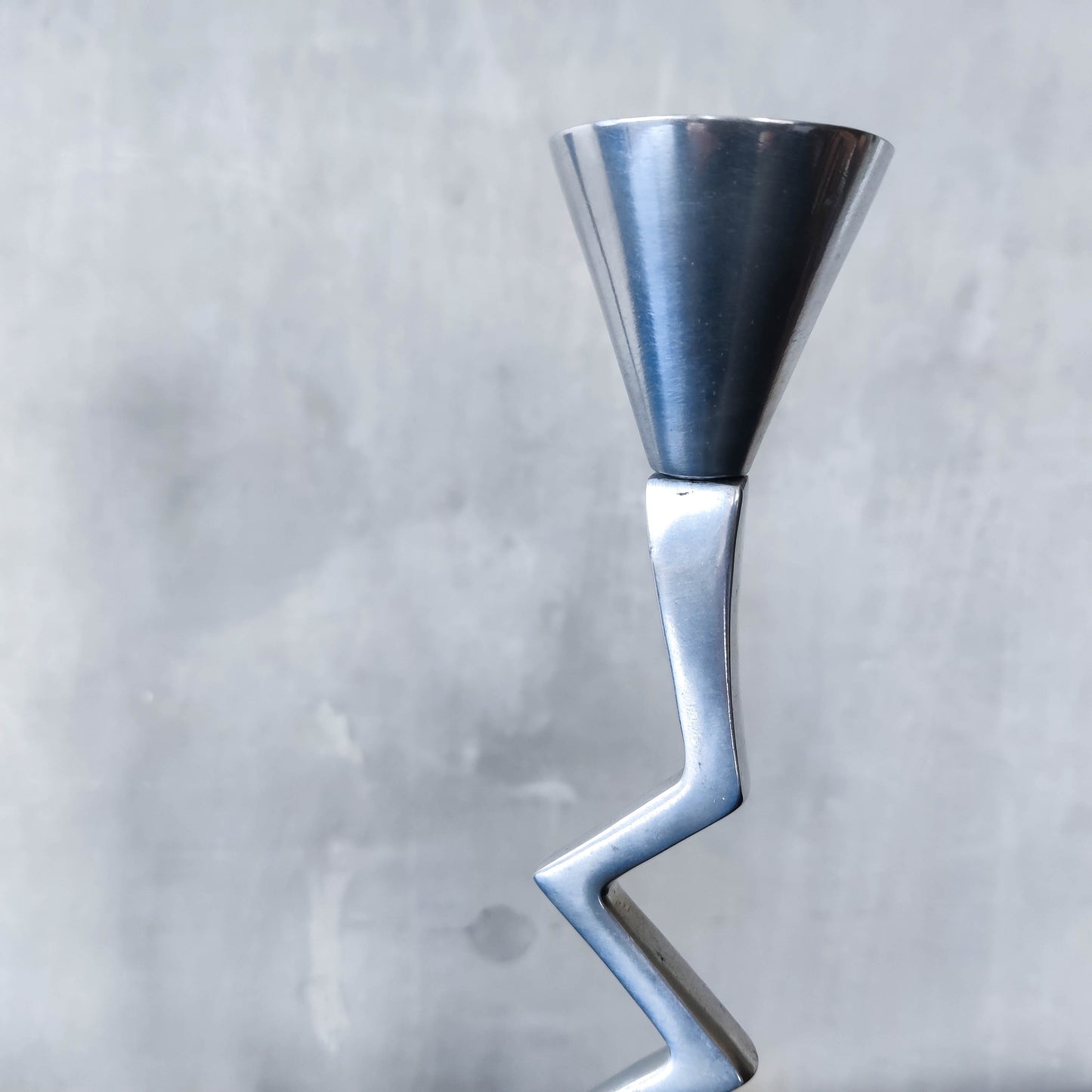 Pair of vintage postmodern chunky sculptural zigzag cast aluminium footed candle holders