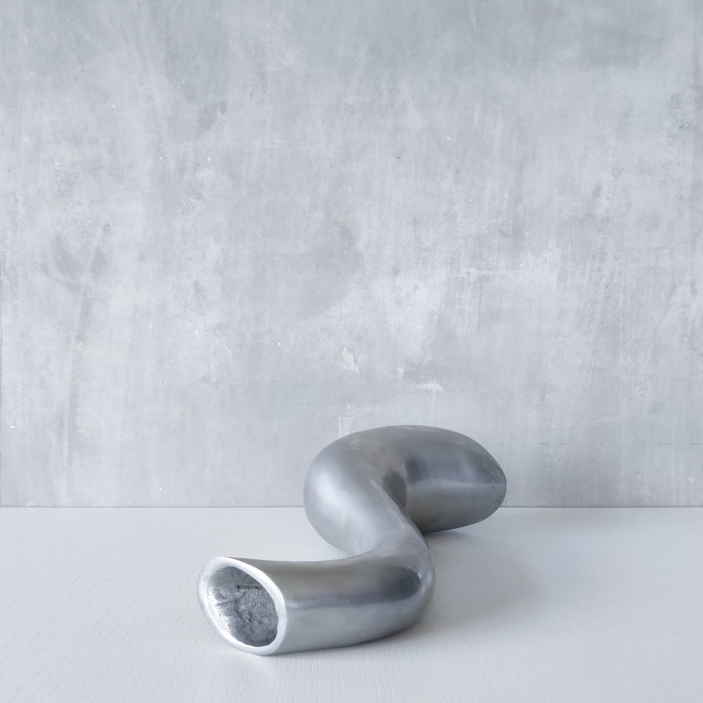 Vintage 1990s hand cast aluminium wavy sculptural S vase