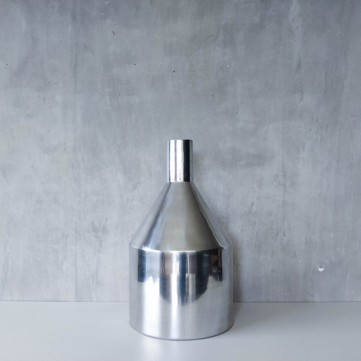 Large cast aluminium sculptural funnel shaped vase