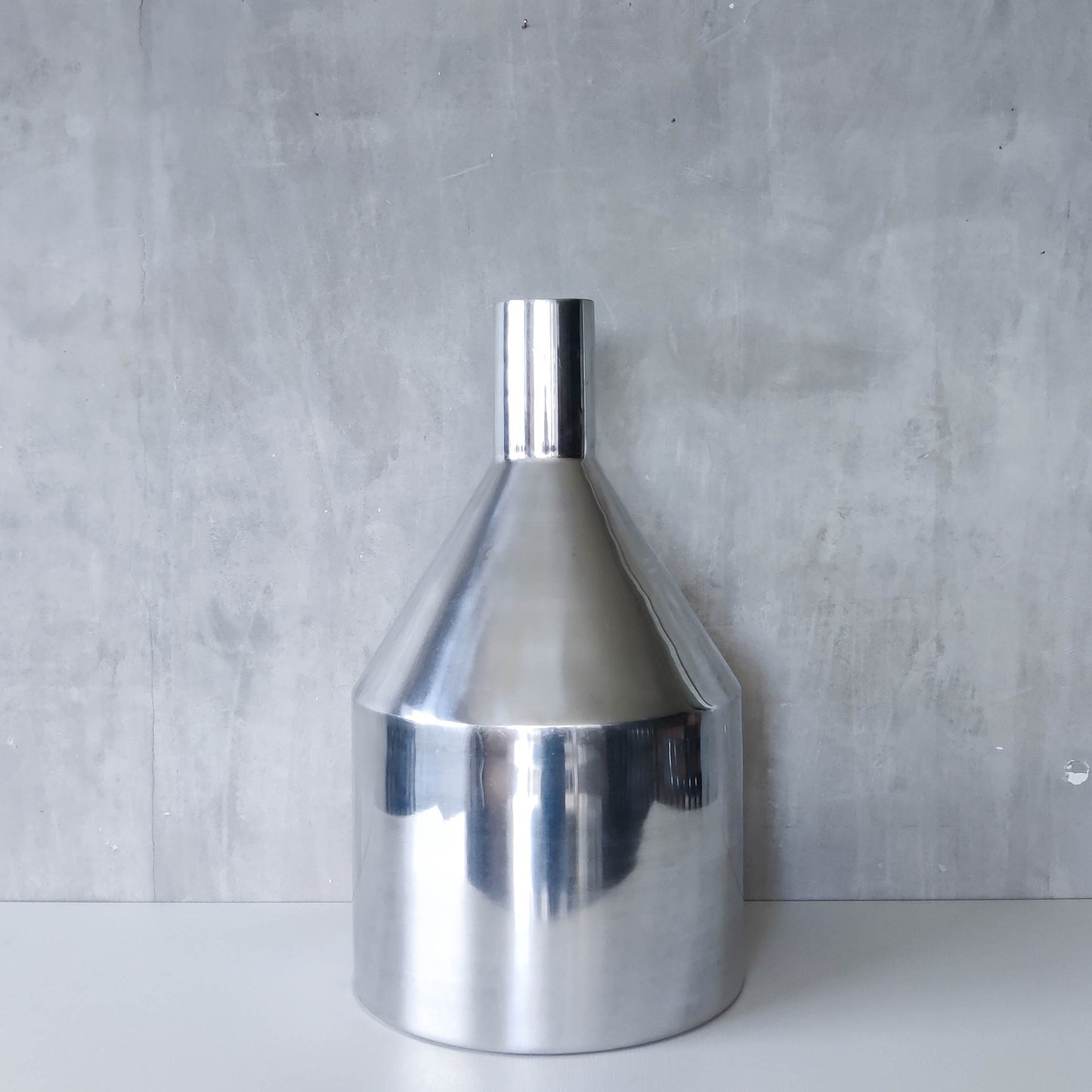 Large cast aluminium sculptural funnel shaped vase