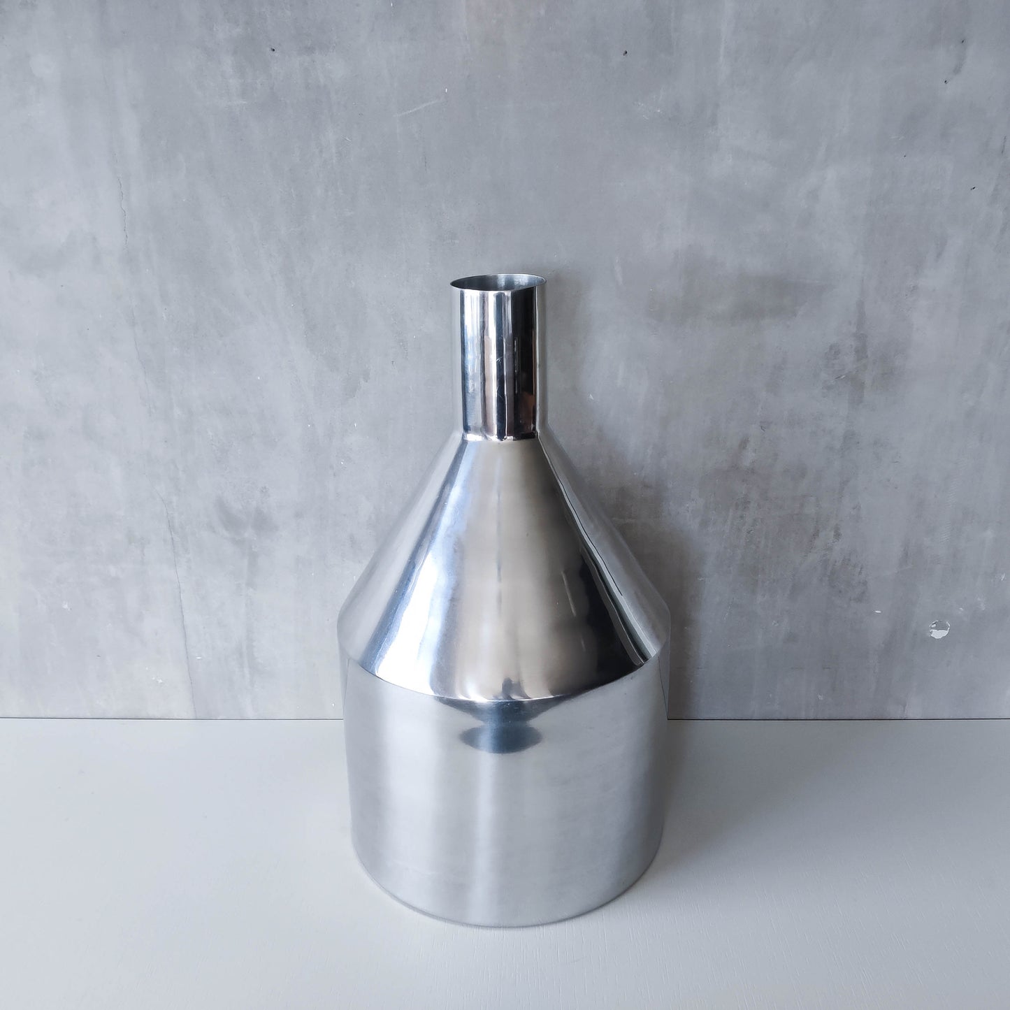 Large cast aluminium sculptural funnel shaped vase